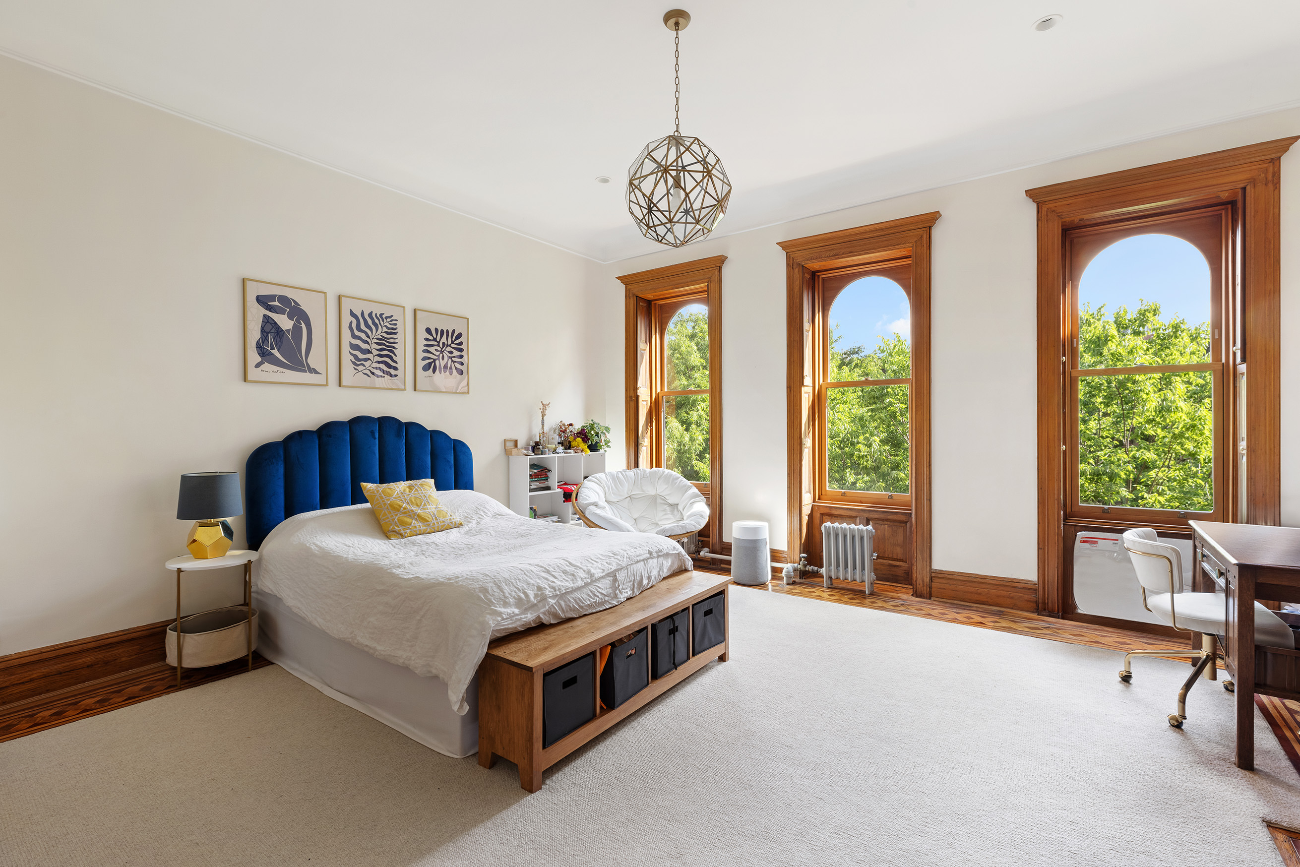 89 West 119th Street Manhattan, NY 10026 - Photo 11 of 22 a spacious bedroom with a bed and a large window