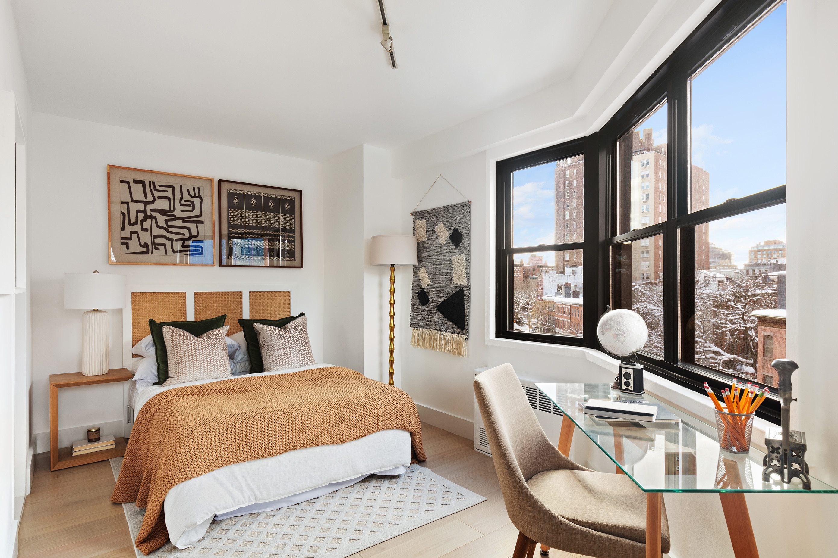 31 Jane Street, Unit 5A Manhattan, NY 10014 - Photo 3 of 13 a bedroom with a bed and wooden floor