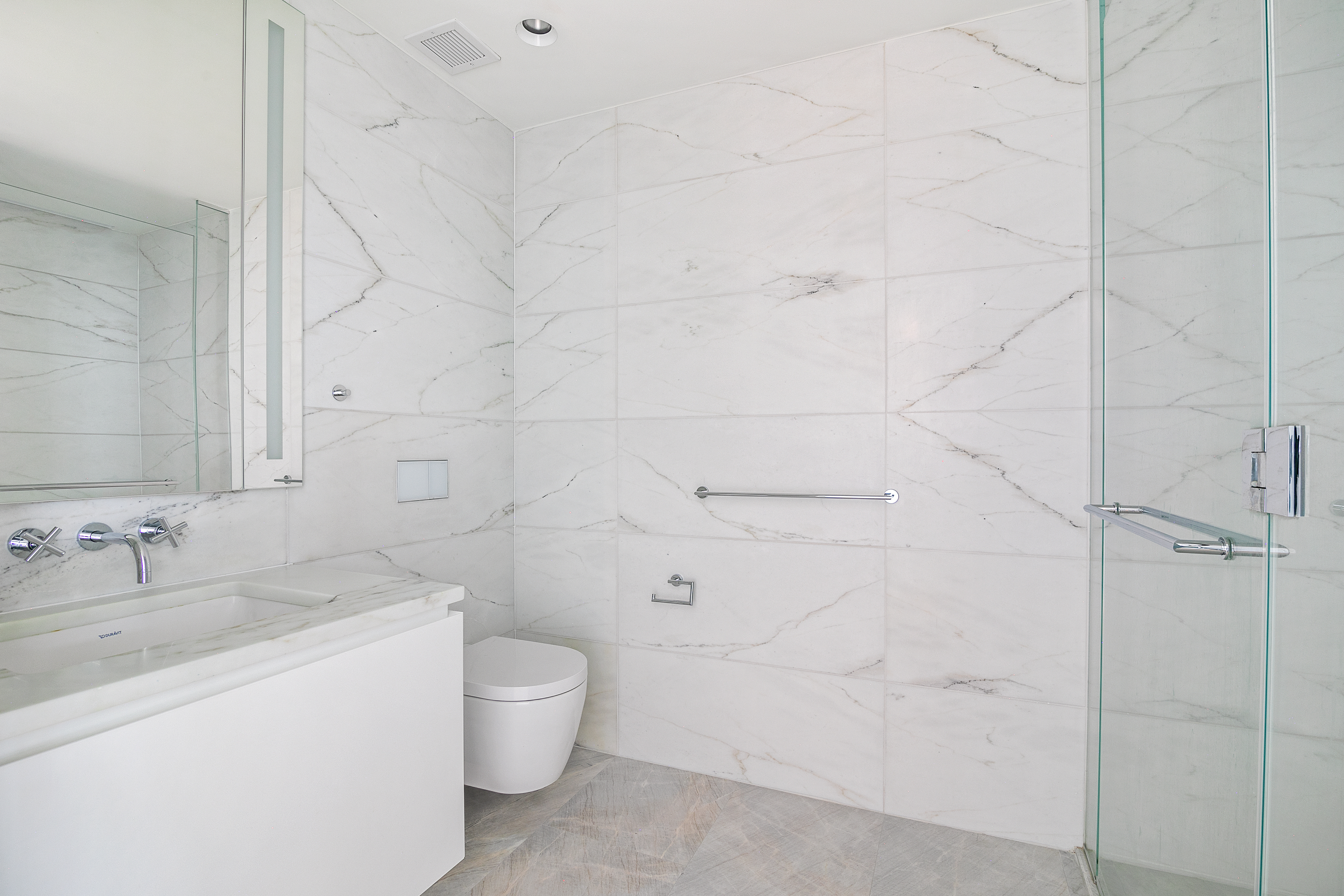 695 1st Avenue, Unit 31C Manhattan, NY 10016 - Photo 7 of 27 a bathroom with a toilet sink and shower