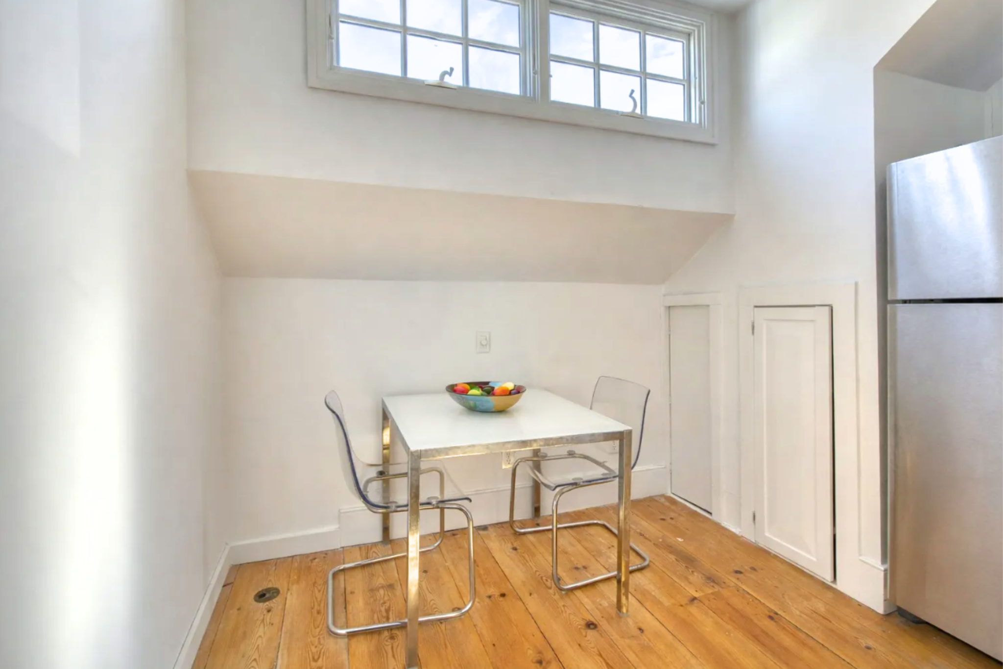 23 Bridge Street Sag Harbor, NY 11963 - Photo 15 of 23 a view of a dining room with furniture and wooden floor