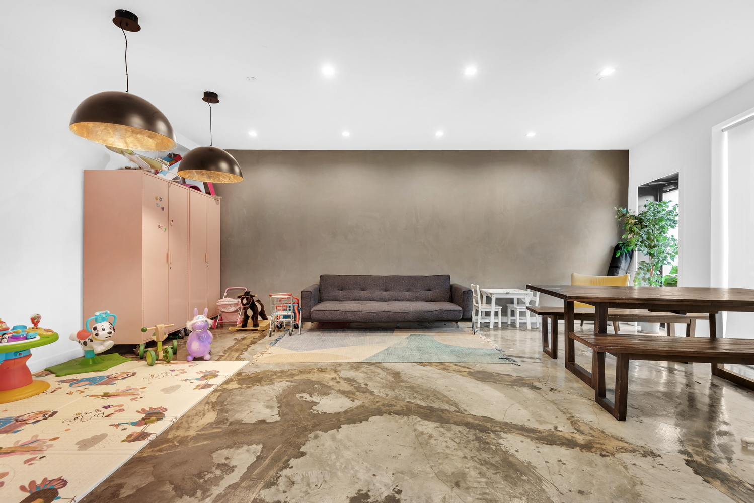 267 Evergreen Avenue, Unit PH Brooklyn, NY 11221 - Photo 16 of 19 a kitchen with granite countertop a stove a sink and a dining table