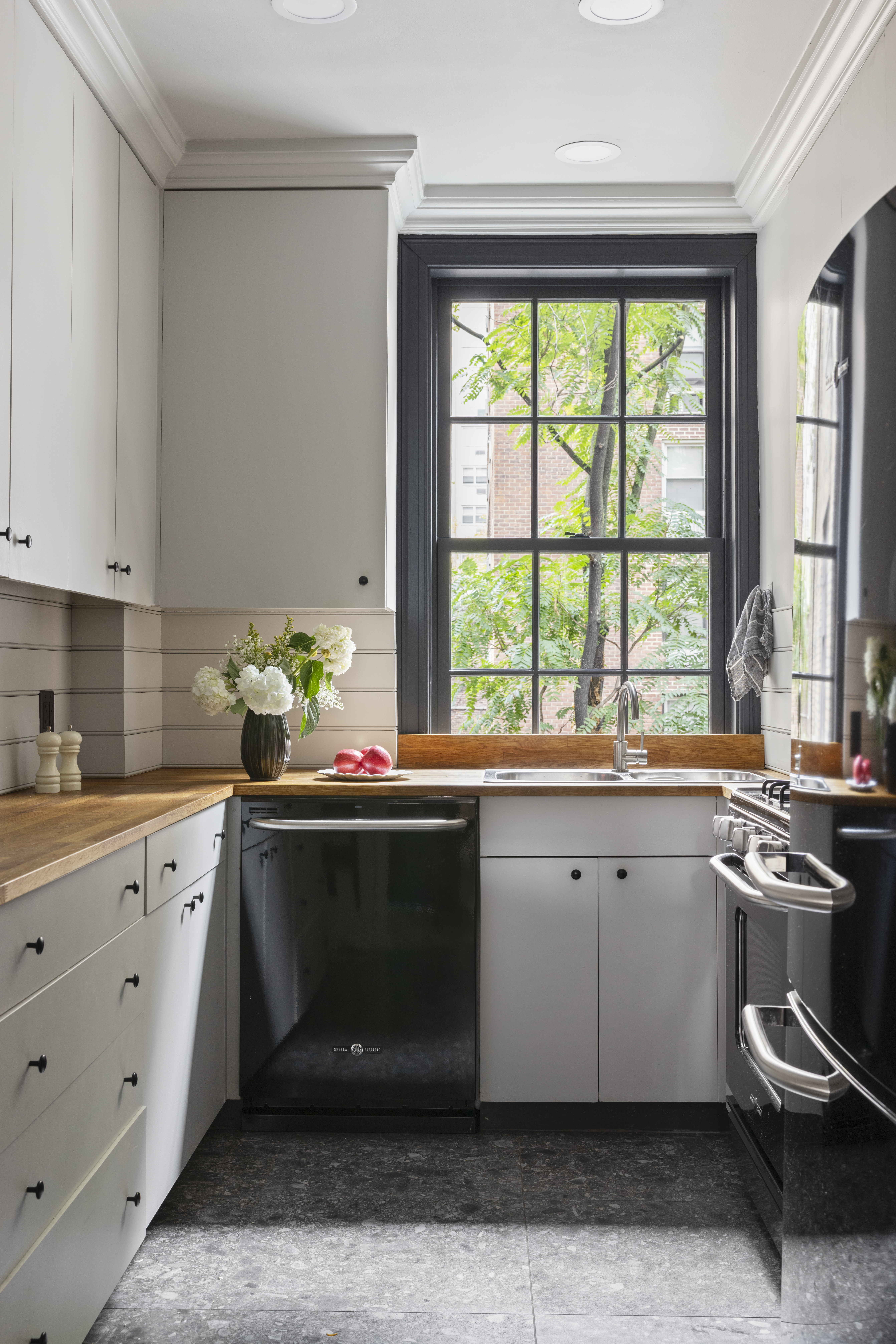 264 Lexington Avenue, Unit 3A Manhattan, NY 10016 - Photo 6 of 12 a kitchen with a sink cabinets and window