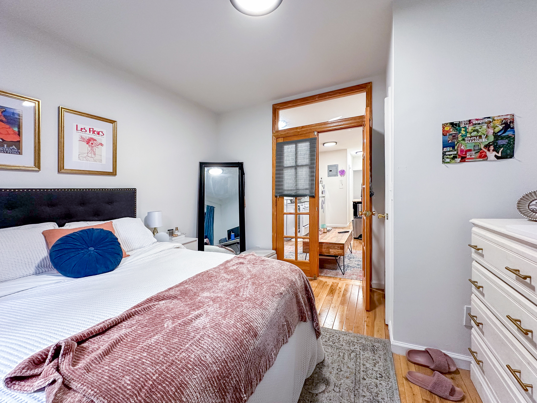 321 East 25th Street, Unit 3A Manhattan, NY 10010 - Photo 2 of 15 a bedroom with a bed and wooden floor