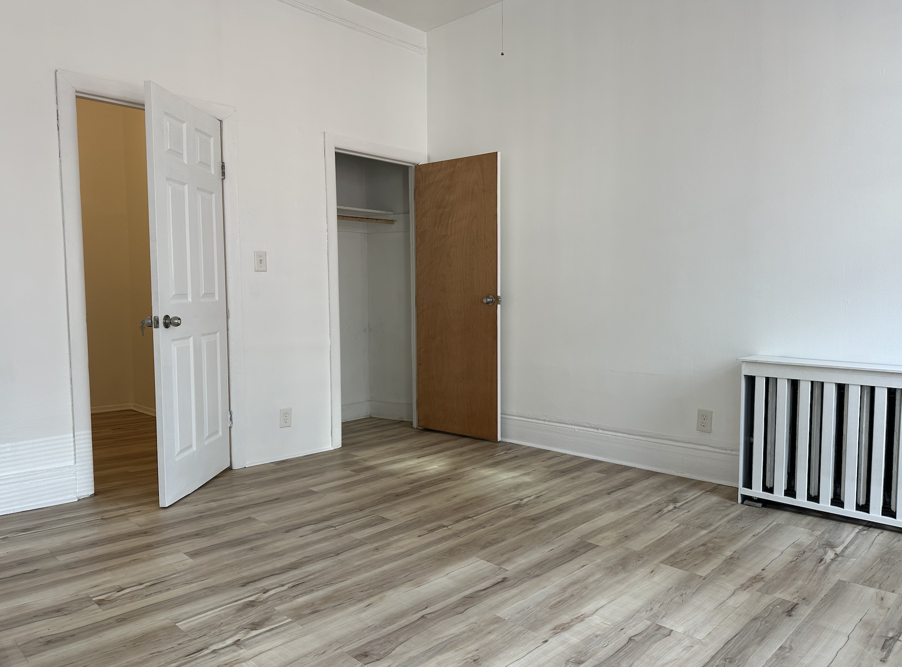 458 West 57th Street, Unit 5FE Manhattan, NY 10019 - Photo 8 of 14 a view of an empty room with wooden floor and closet