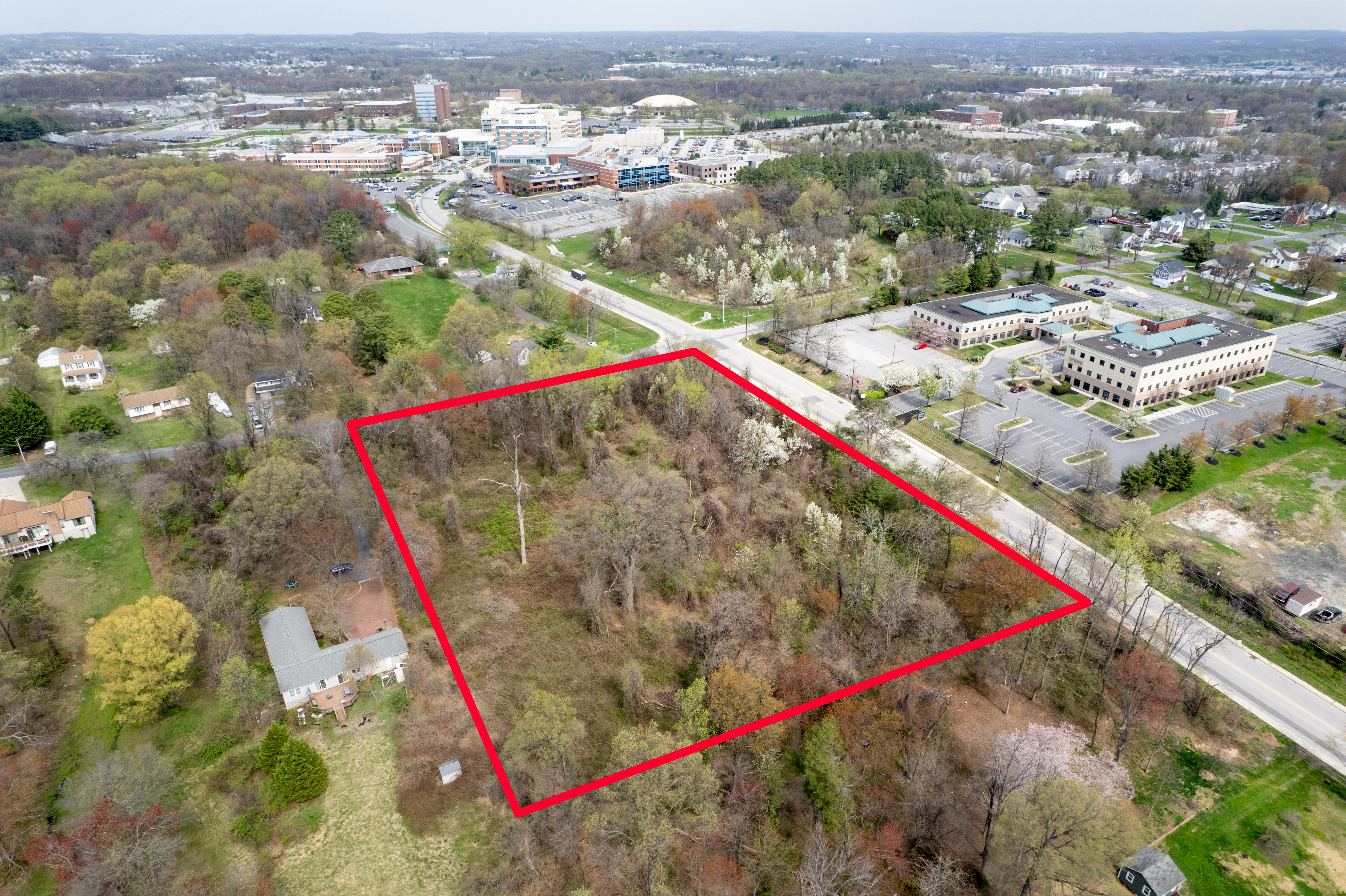 an aerial view of residential house with an outdoor space and seating