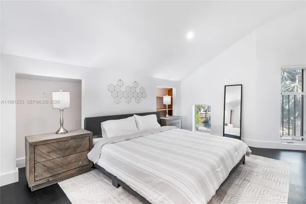 a bedroom with bed and window