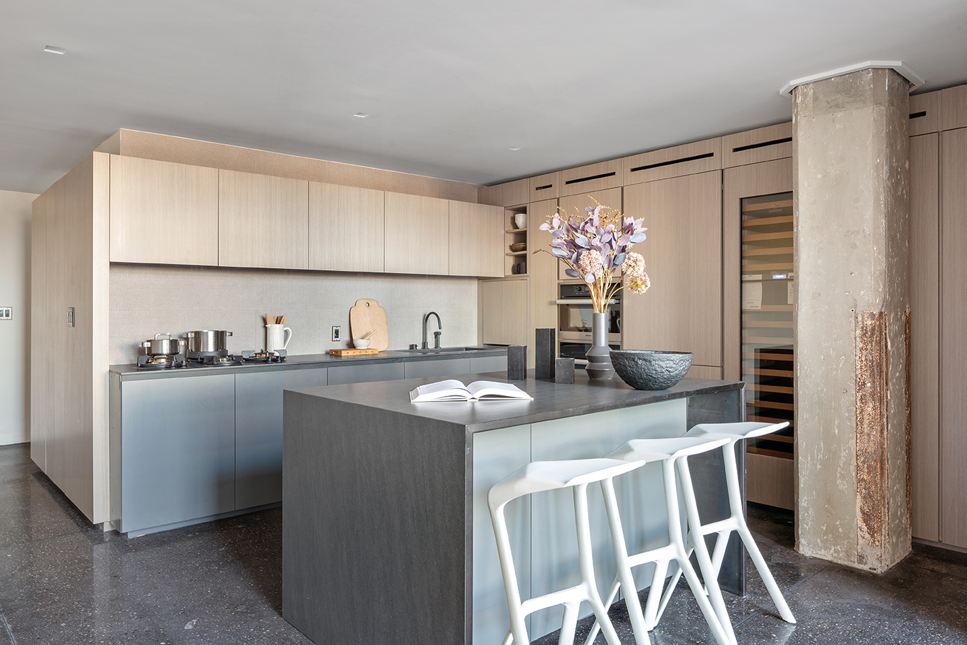 330 Wythe Avenue, Unit 6I Brooklyn, NY 11249 - Photo 4 of 14 a kitchen with stainless steel appliances granite countertop a sink and a refrigerator
