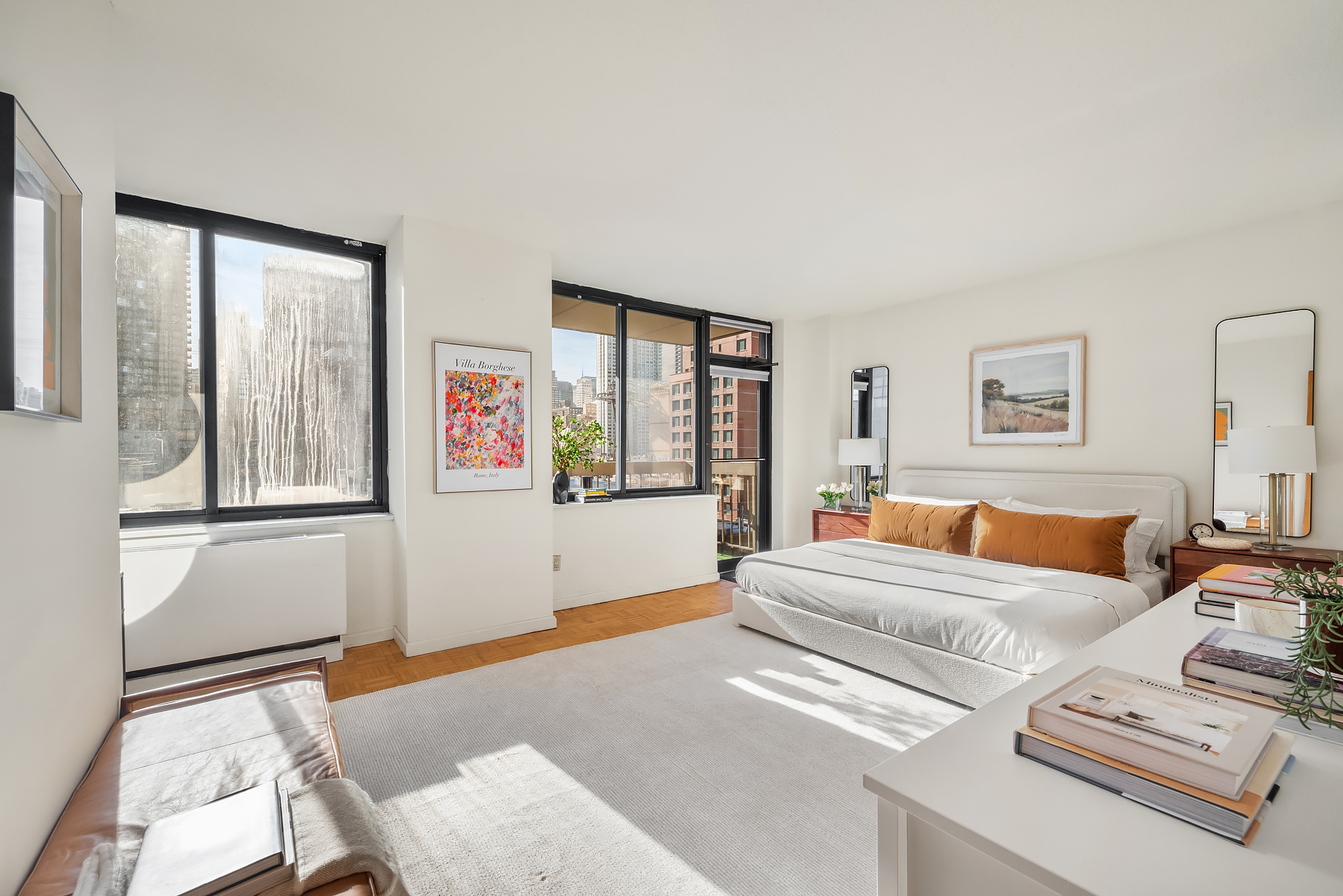 403 East 62nd Street, Unit 9D Manhattan, NY 10065 - Photo 5 of 9 a bedroom with furniture and a window
