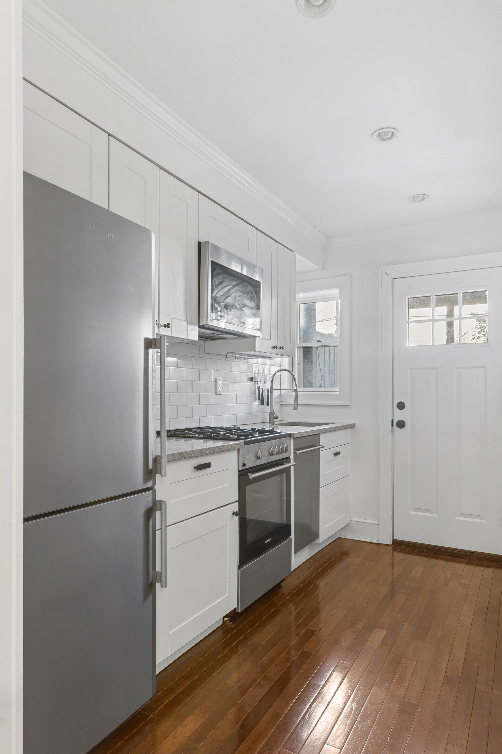 595 Madison Street, Unit GARDEN Brooklyn, NY 11221 - Photo 4 of 9 a kitchen with a refrigerator stove and sink