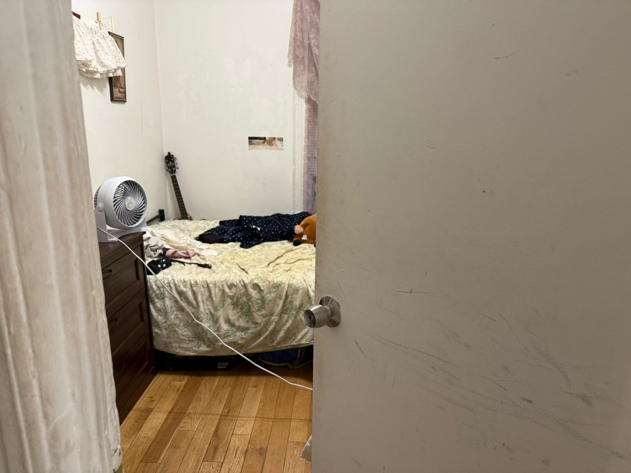 1278 1st Avenue, Unit 2 Manhattan, NY 10065 - Photo 11 of 19 a bed sitting in a bedroom next to a window