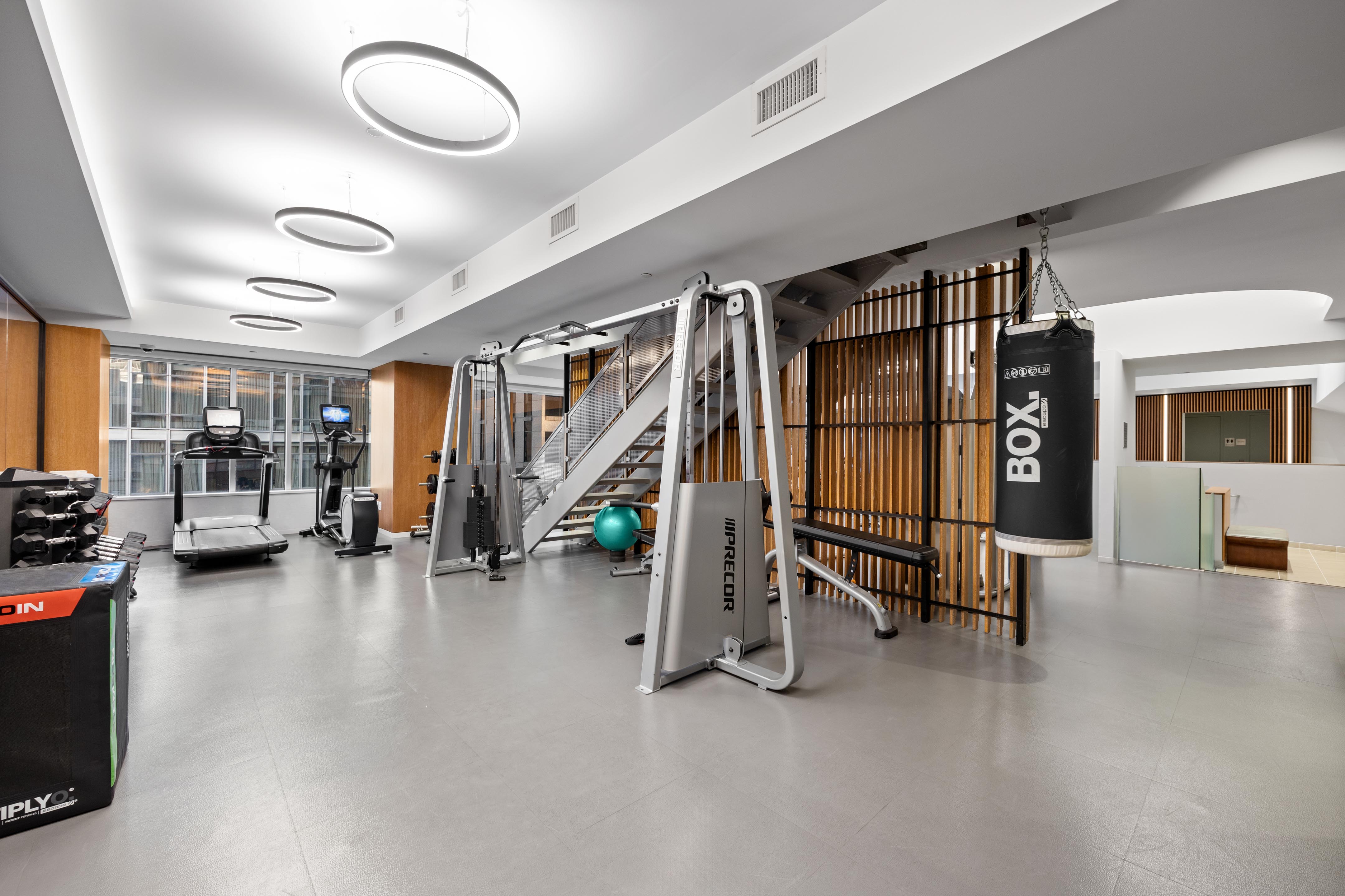 15 West 53rd Street, Unit 10H Manhattan, NY 10019 - Photo 8 of 11 a view of a room with gym equipment