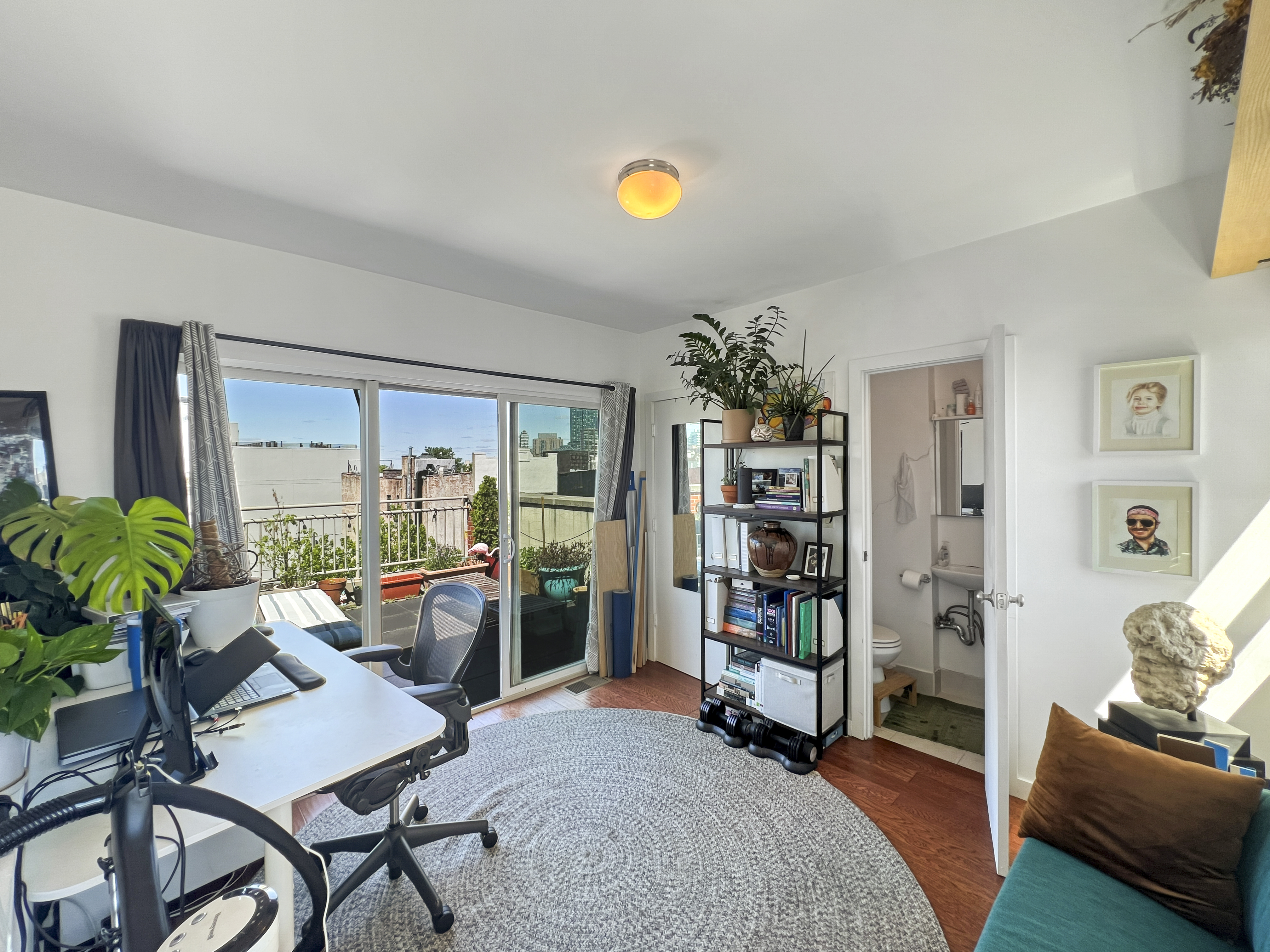 643 Washington Avenue, Unit 2 Brooklyn, NY 11238 - Photo 6 of 12 a living room with furniture and a bookshelf