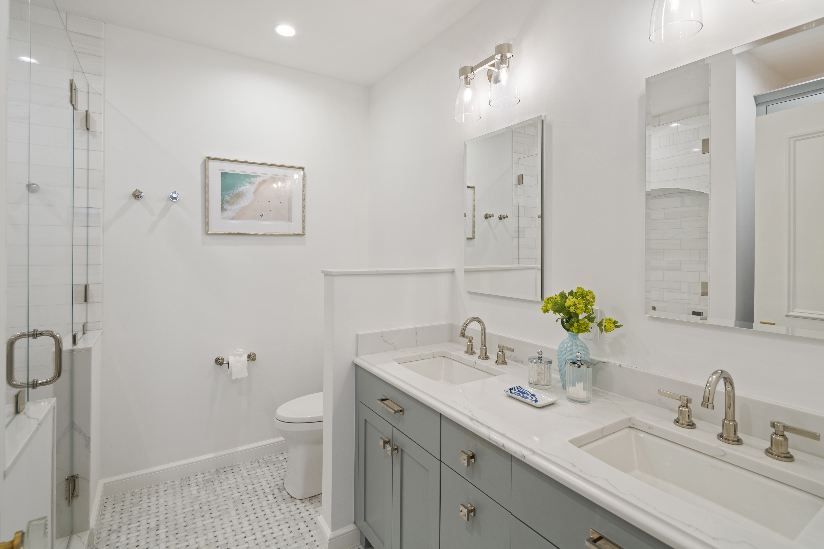 41-43 Phillips Street, Unit 4 Boston, MA 02114 - Photo 6 of 9 a bathroom with a sink a toilet and a mirror