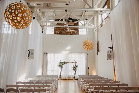 a view of empty room with wooden floor and window