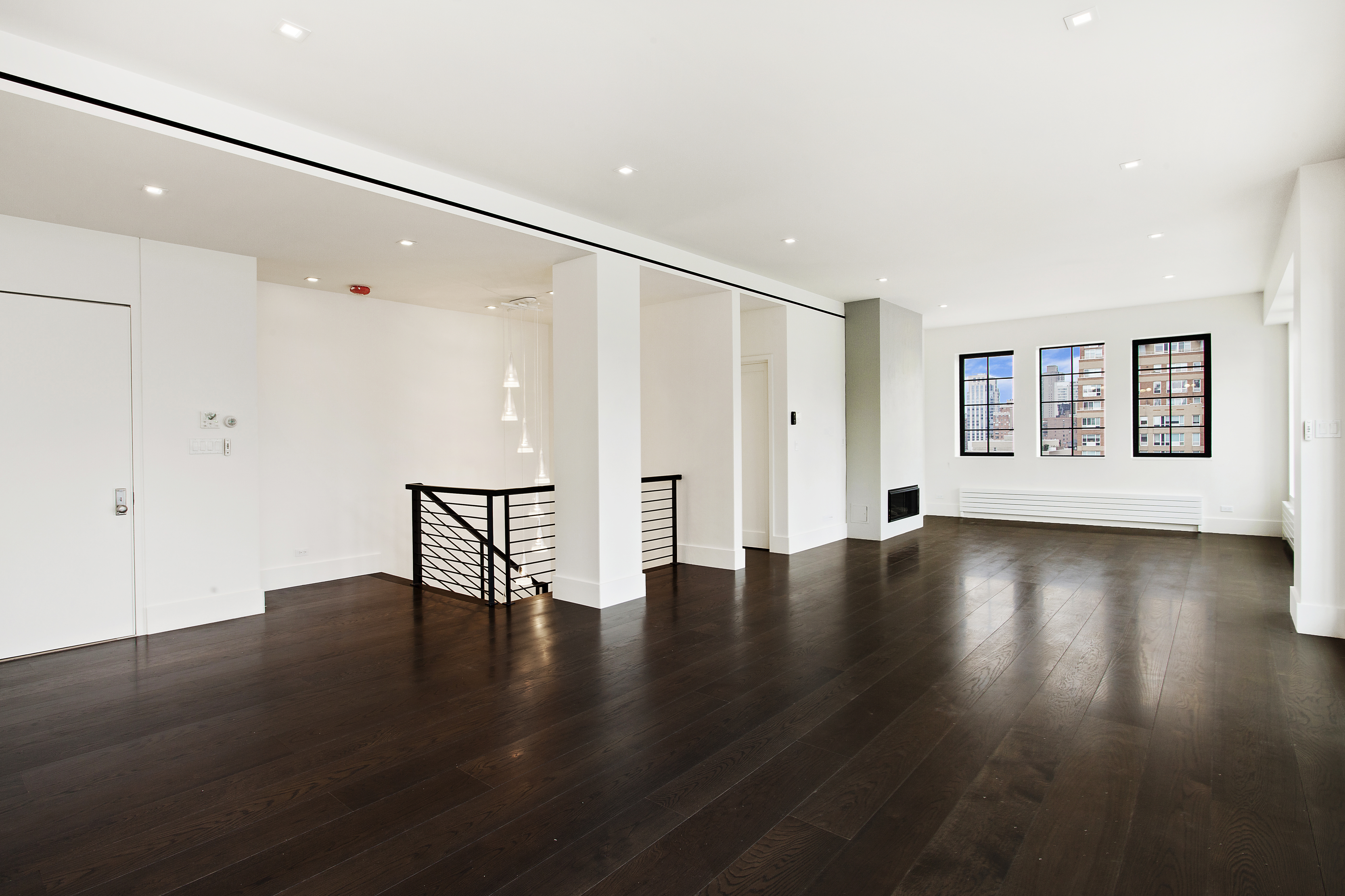 East 80th Street Manhattan, NY 10075 - Photo 12 of 13 a view of an empty room with wooden floor and a window