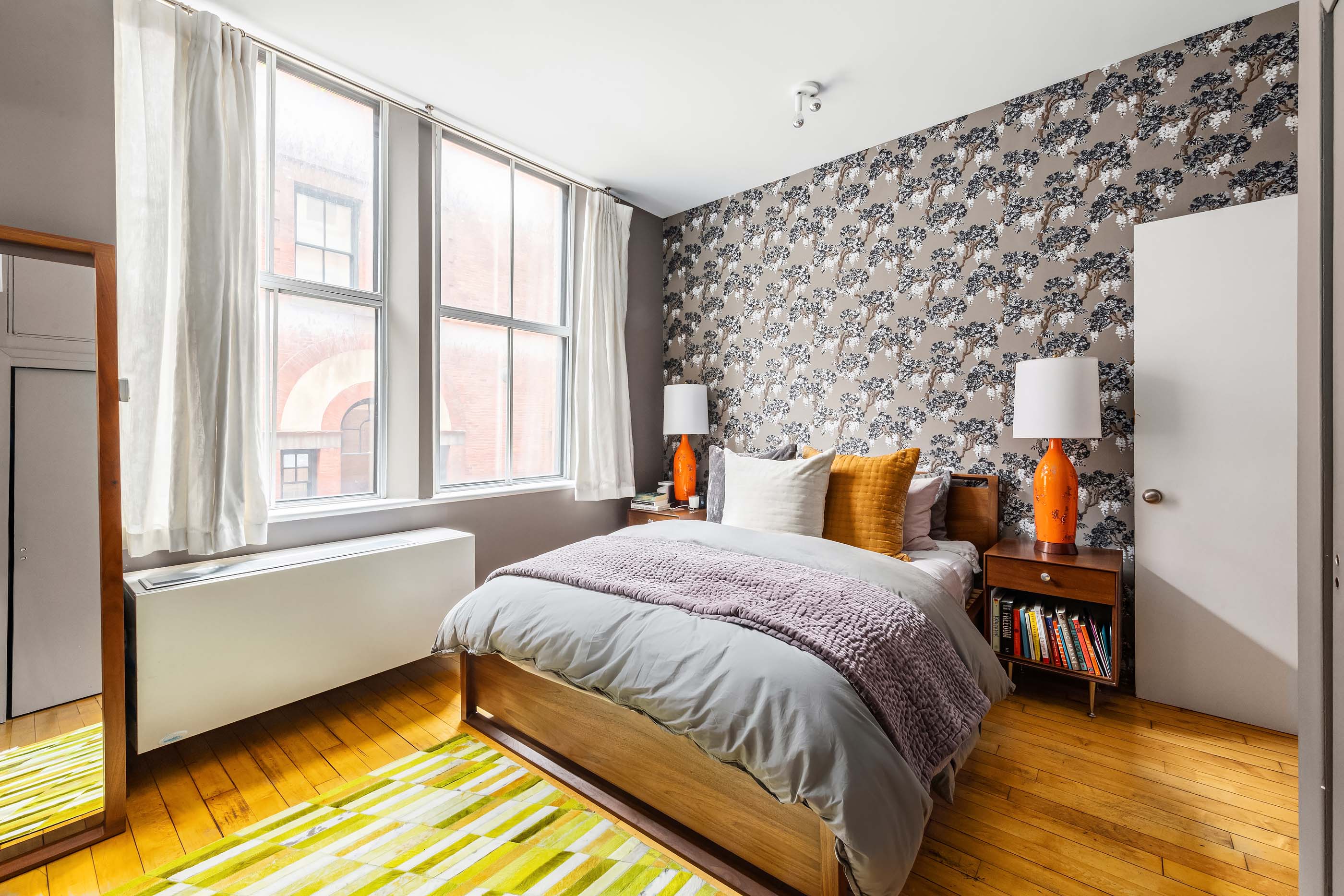 57 Laight Street, Unit 3 Manhattan, NY 10013 - Photo 7 of 15 a bedroom with a bed and a large window with outer view