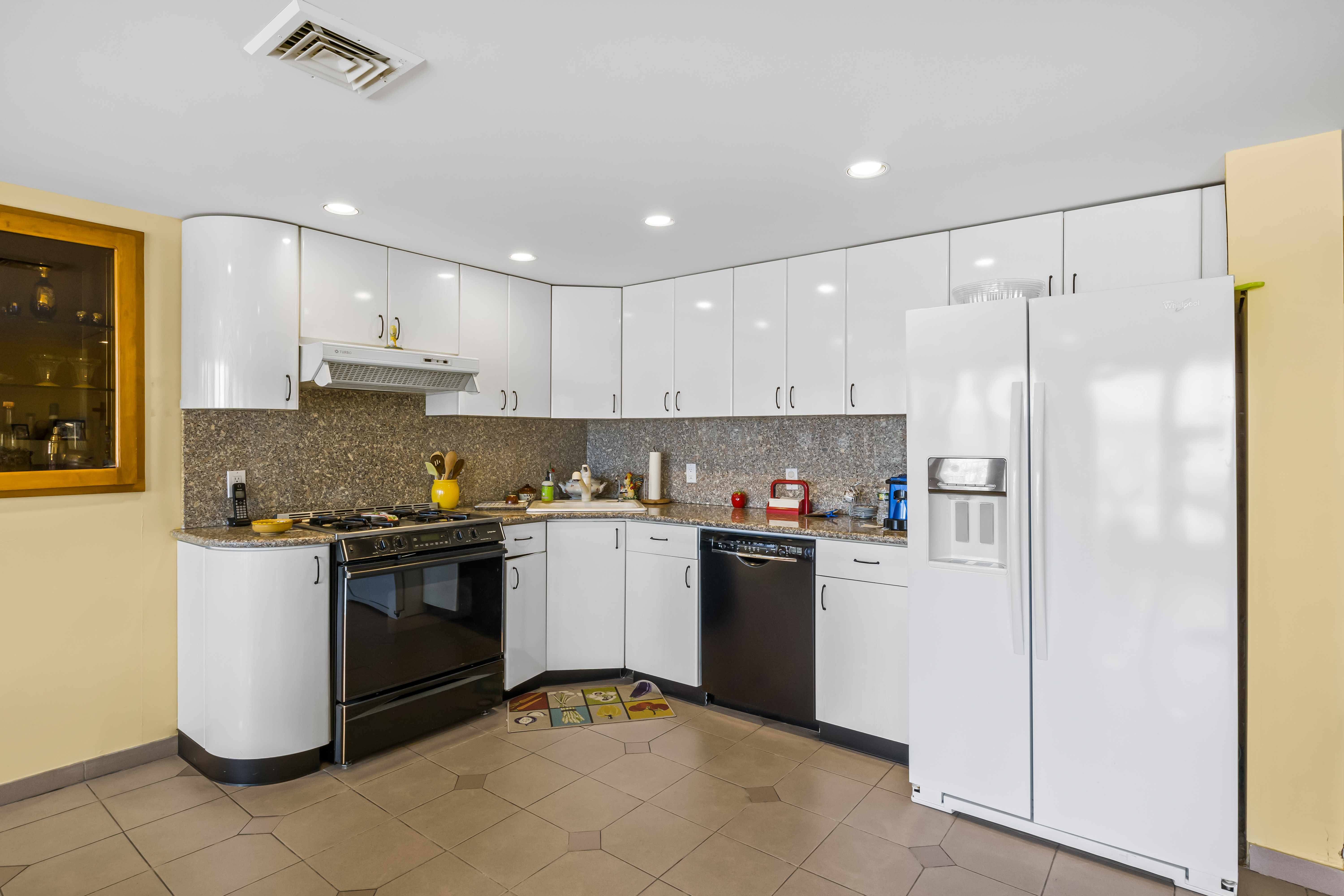 303 Whitman Drive Brooklyn, NY 11234 - Photo 29 of 37 a kitchen with stainless steel appliances granite countertop a refrigerator and a stove