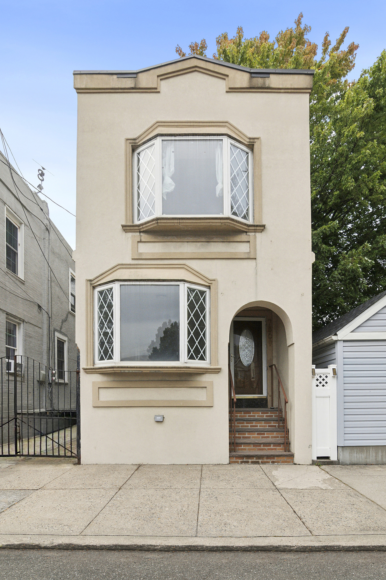 a front view of a house with garage