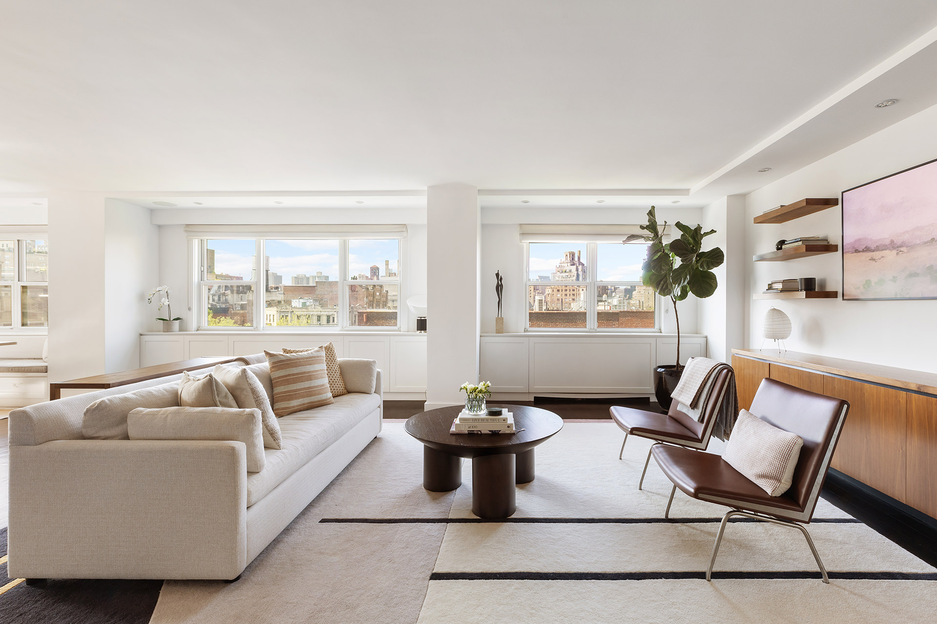 101 West 12th Street, Unit 8RS Manhattan, NY 10011 - Photo 2 of 19 a living room with furniture and a large window