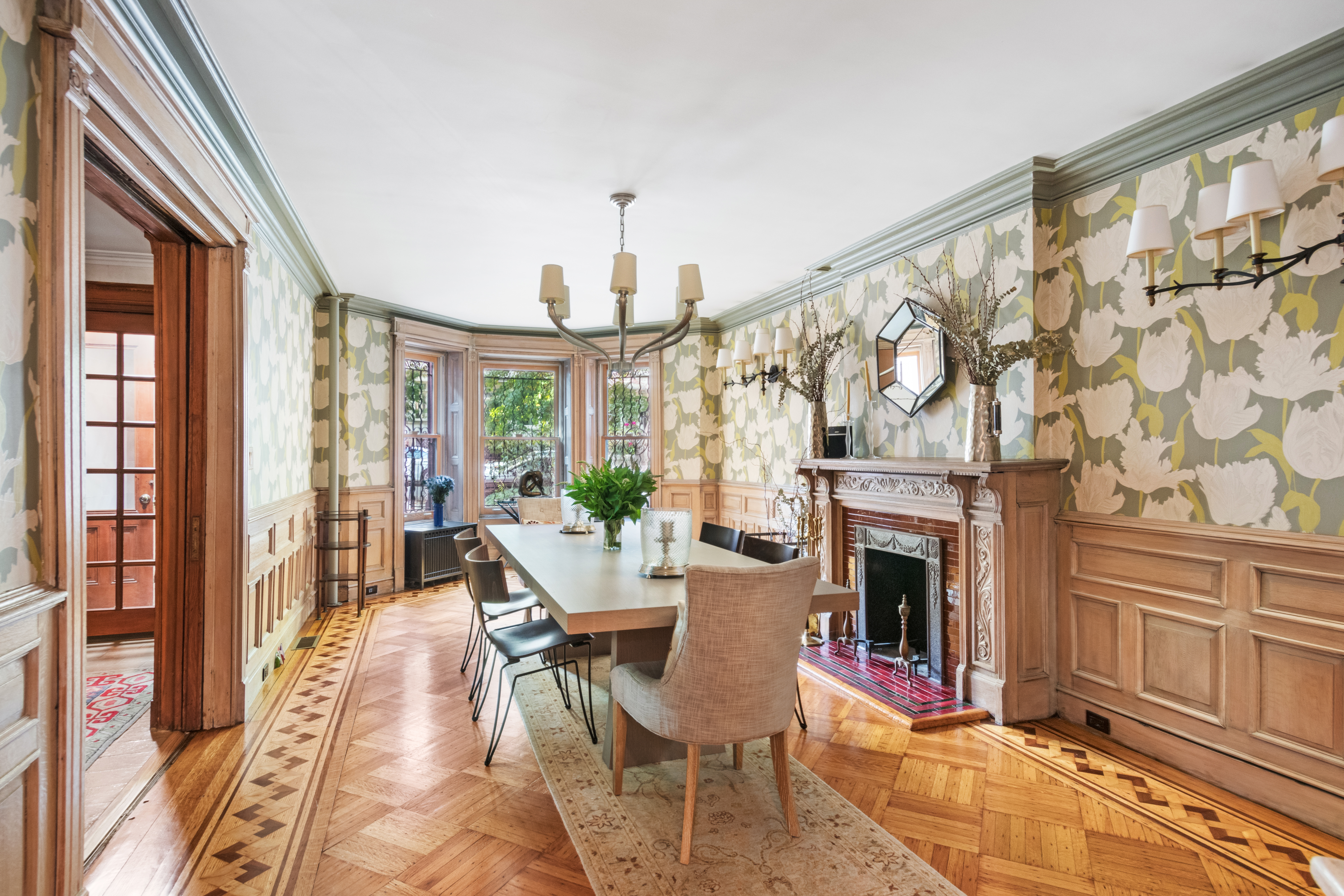 545 3rd Street Brooklyn, NY 11215 - Photo 5 of 20 a living room with furniture a fireplace and a floor to ceiling window