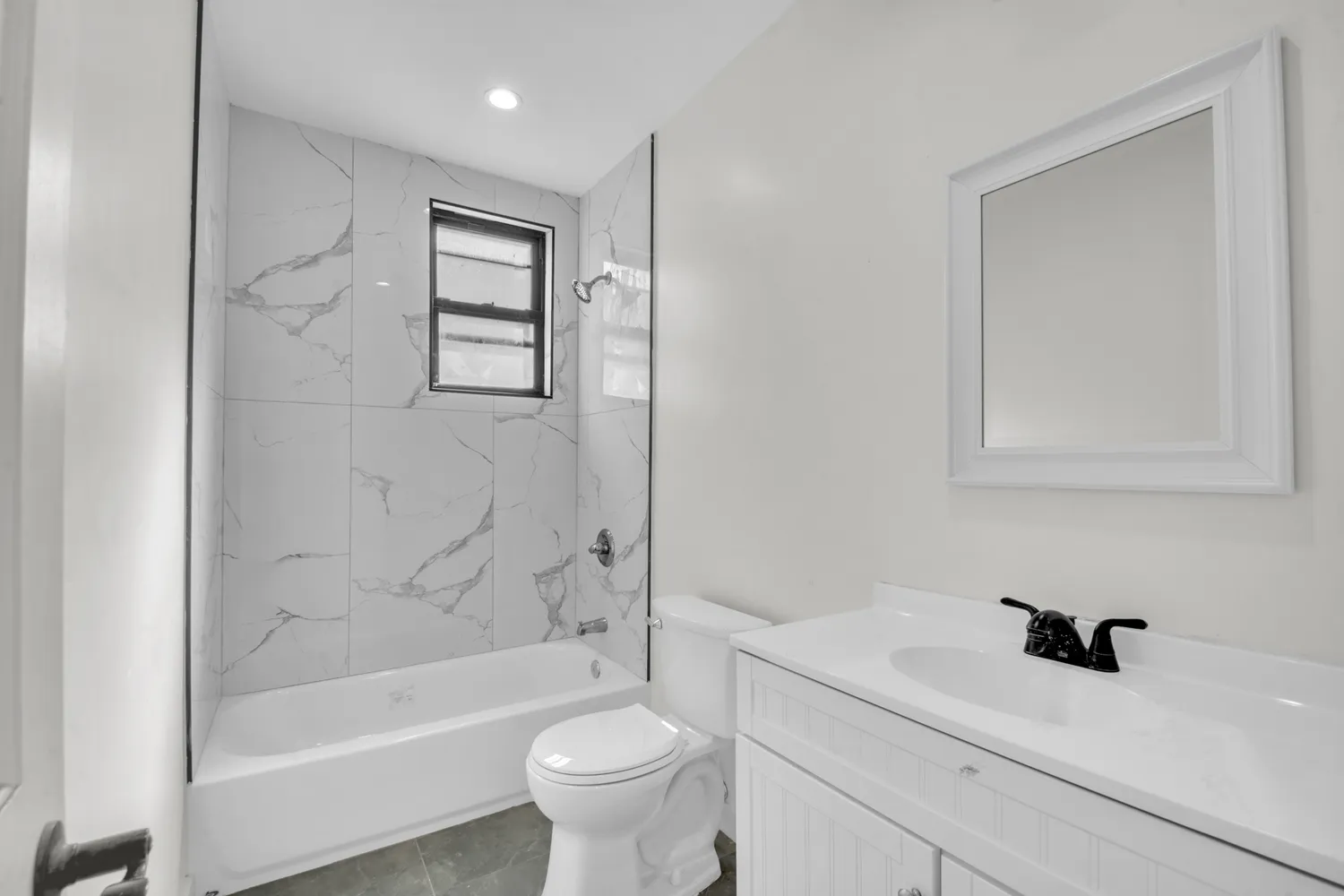 a bathroom with a sink a toilet and bathtub