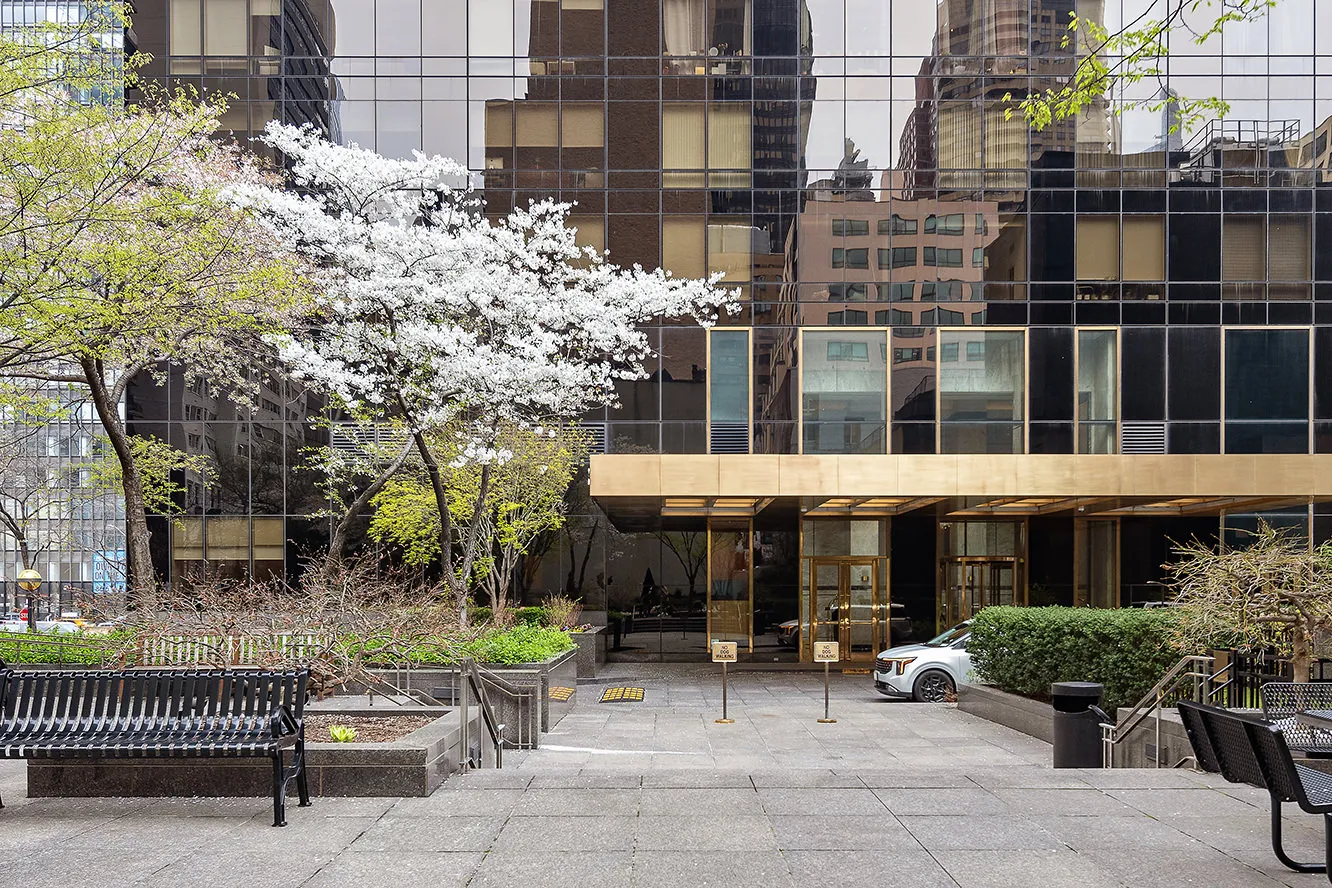 a view of a building with sitting area