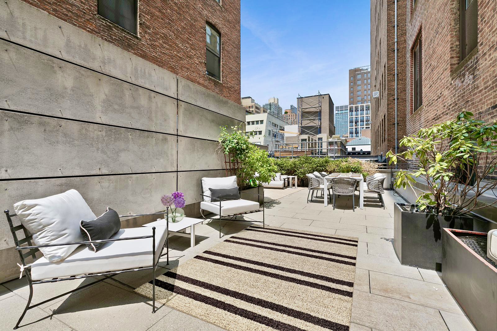 29 West 21st Street, Unit PH Manhattan, NY 10010 - Photo 2 of 17 a view of a patio with couches and potted plants