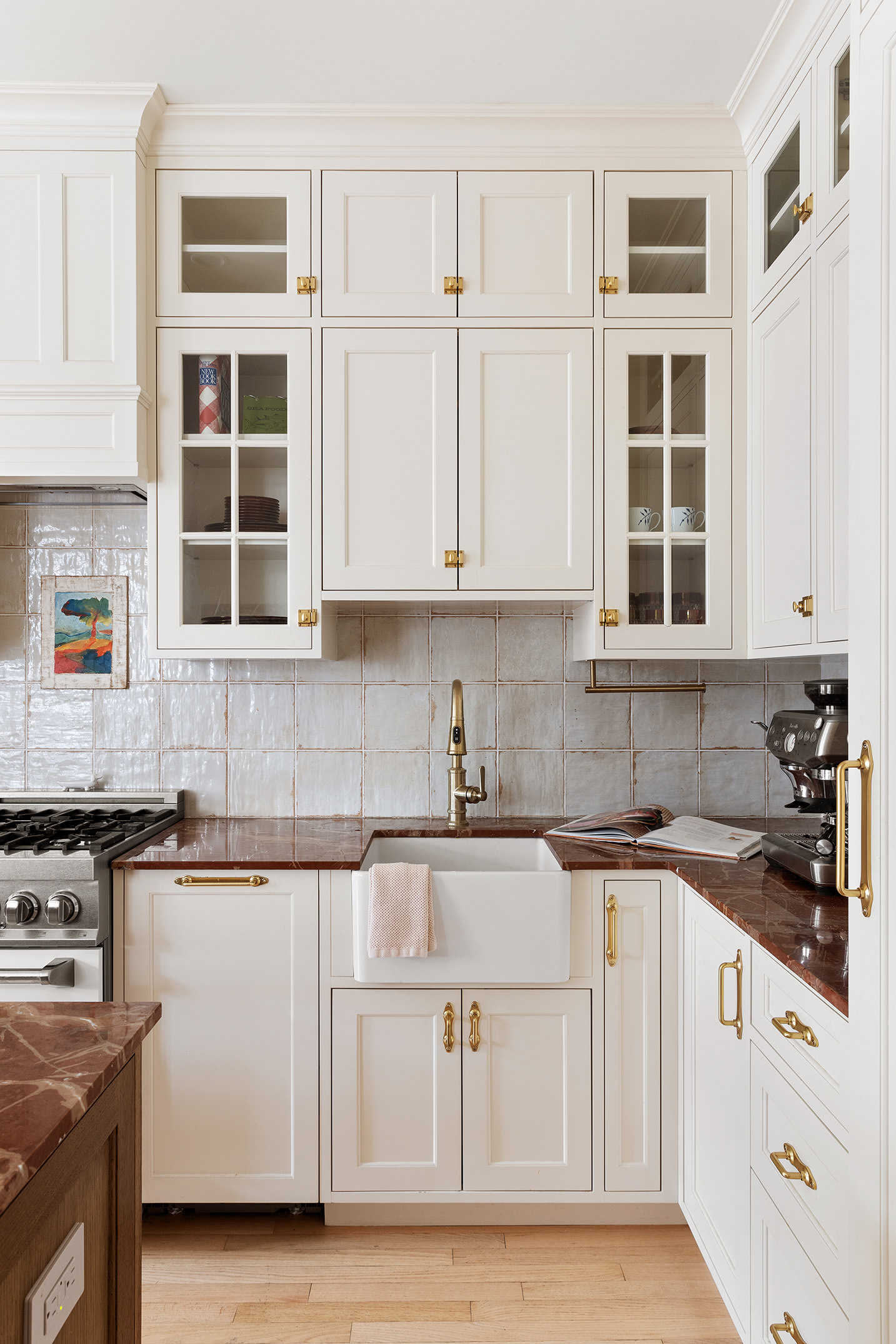 2109 Broadway, Unit 4126 Manhattan, NY 10023 - Photo 5 of 18 a kitchen with granite countertop white cabinets and window