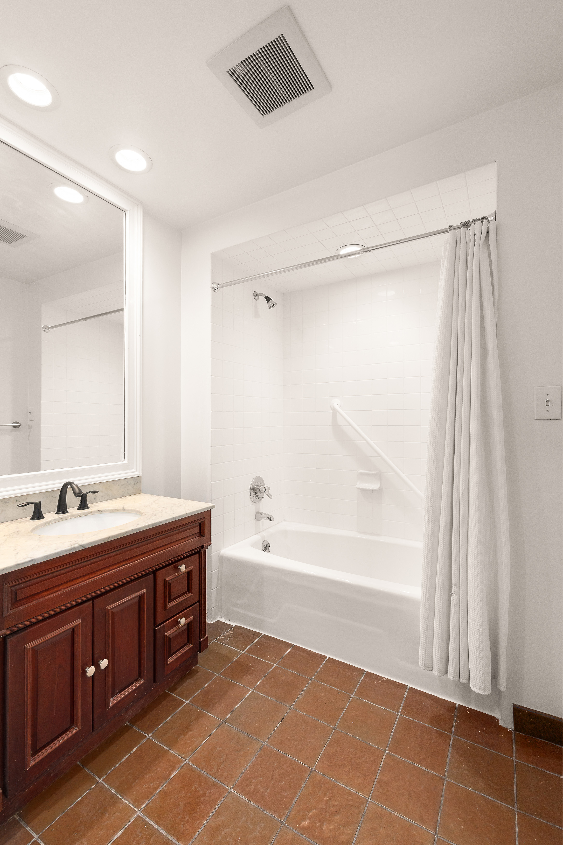 176 Warren Street, Unit GARDEN Brooklyn, NY 11201 - Photo 5 of 9 a spacious bathroom with a tub sink and mirror