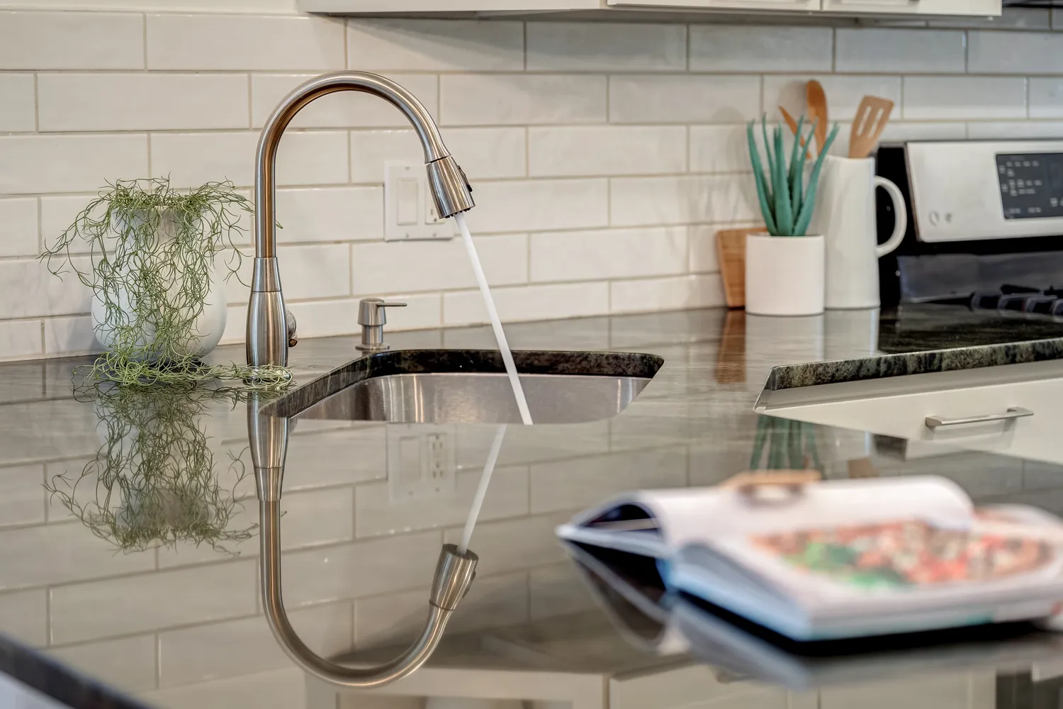 a view of a hallway with wooden floor and stairs