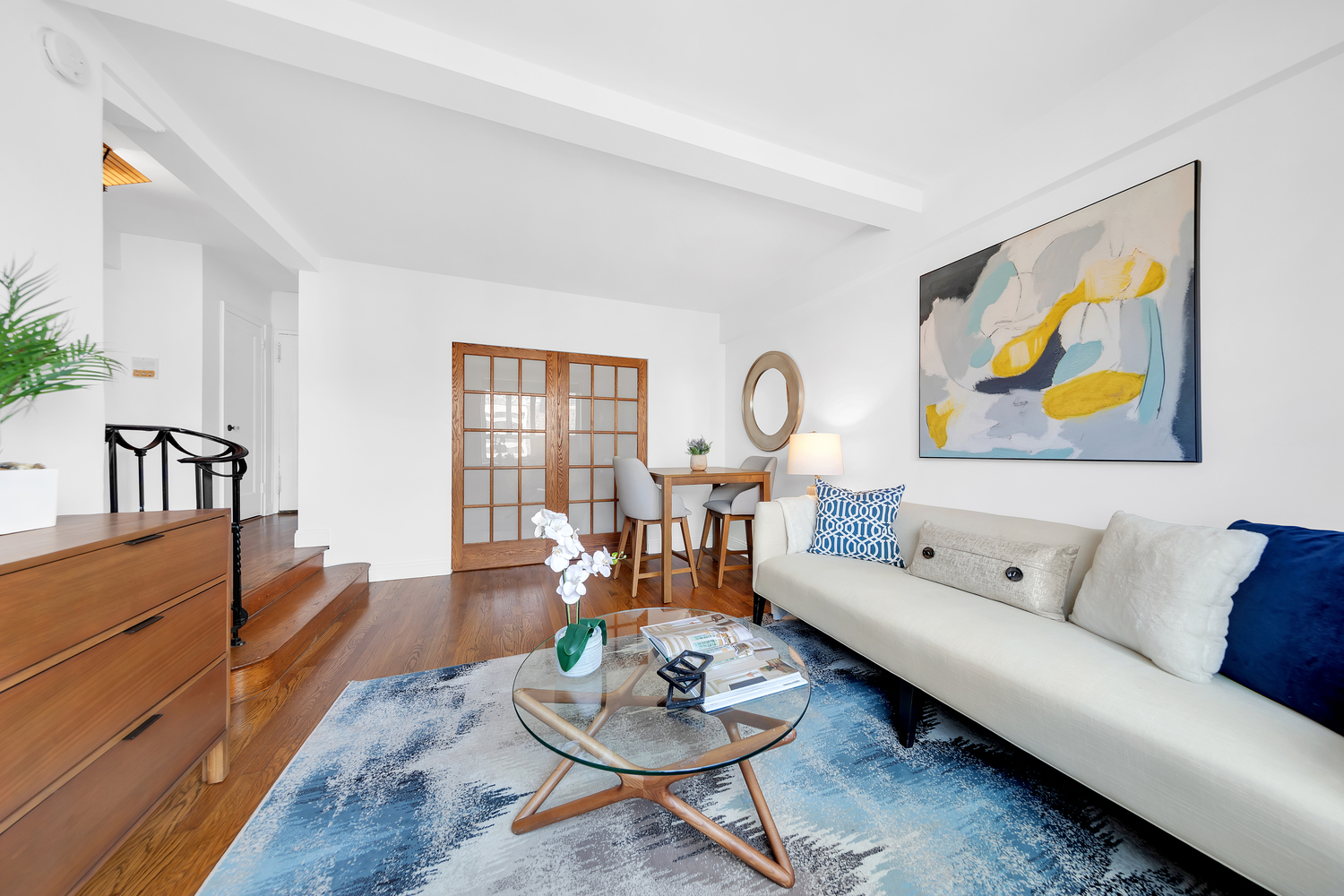 200 West 20th Street, Unit 1110 Manhattan, NY 10011 - Photo 2 of 10 a living room with furniture and wooden floor