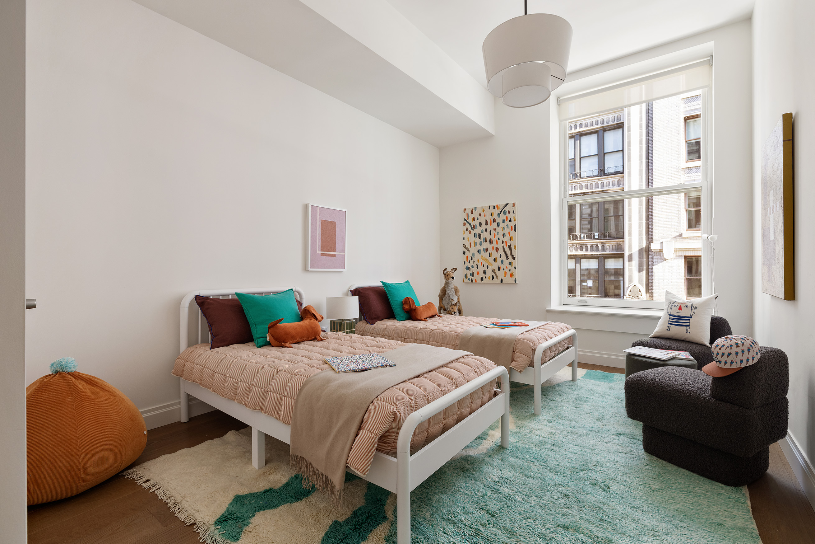 42 East 20th Street, Unit 4AD Manhattan, NY 10003 - Photo 15 of 19 a bedroom with a bed and wooden floor