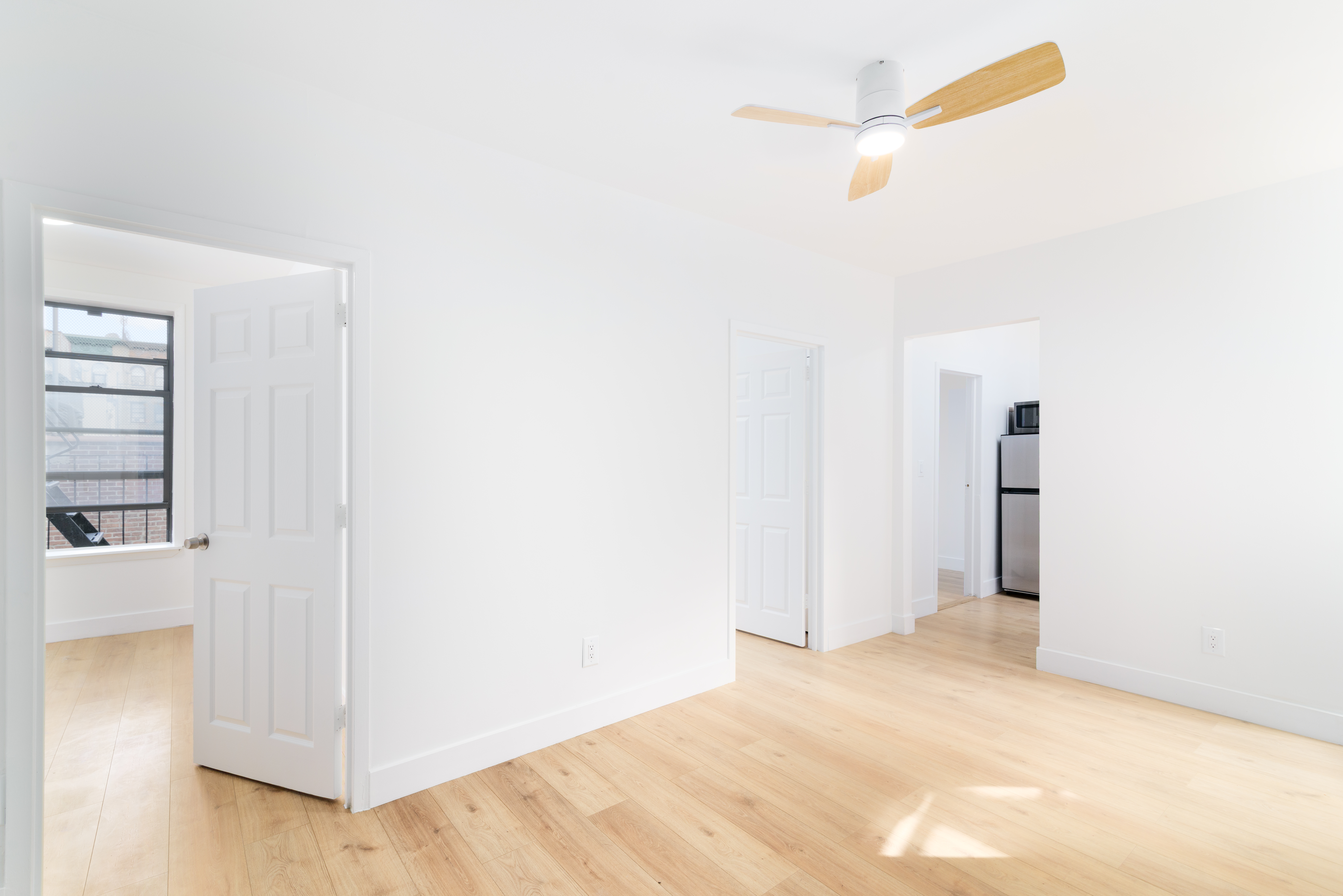 517 West 144th Street, Unit 9 Manhattan, NY 10031 - Photo 17 of 22 a view of empty room with wooden floor