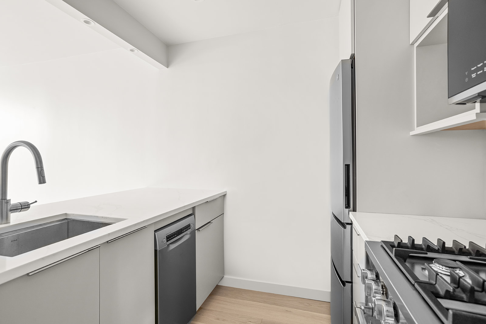 500 West 43rd Street, Unit 3B Manhattan, NY 10036 - Photo 6 of 19 a kitchen with a sink and cabinets
