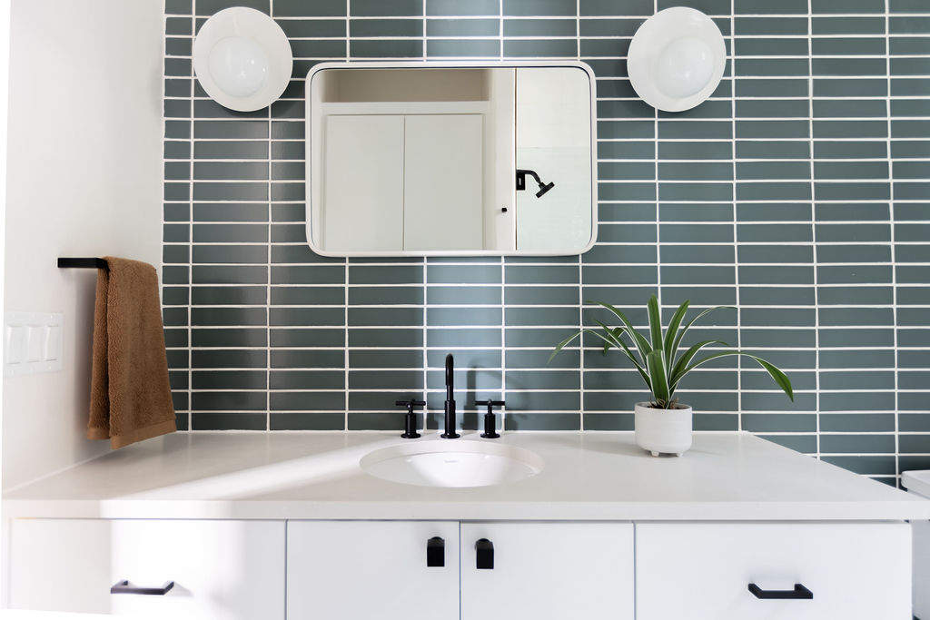 400 Inwood Road Austin, TX 78746 - Photo 38 of 43 a bathroom with a sink and a mirror