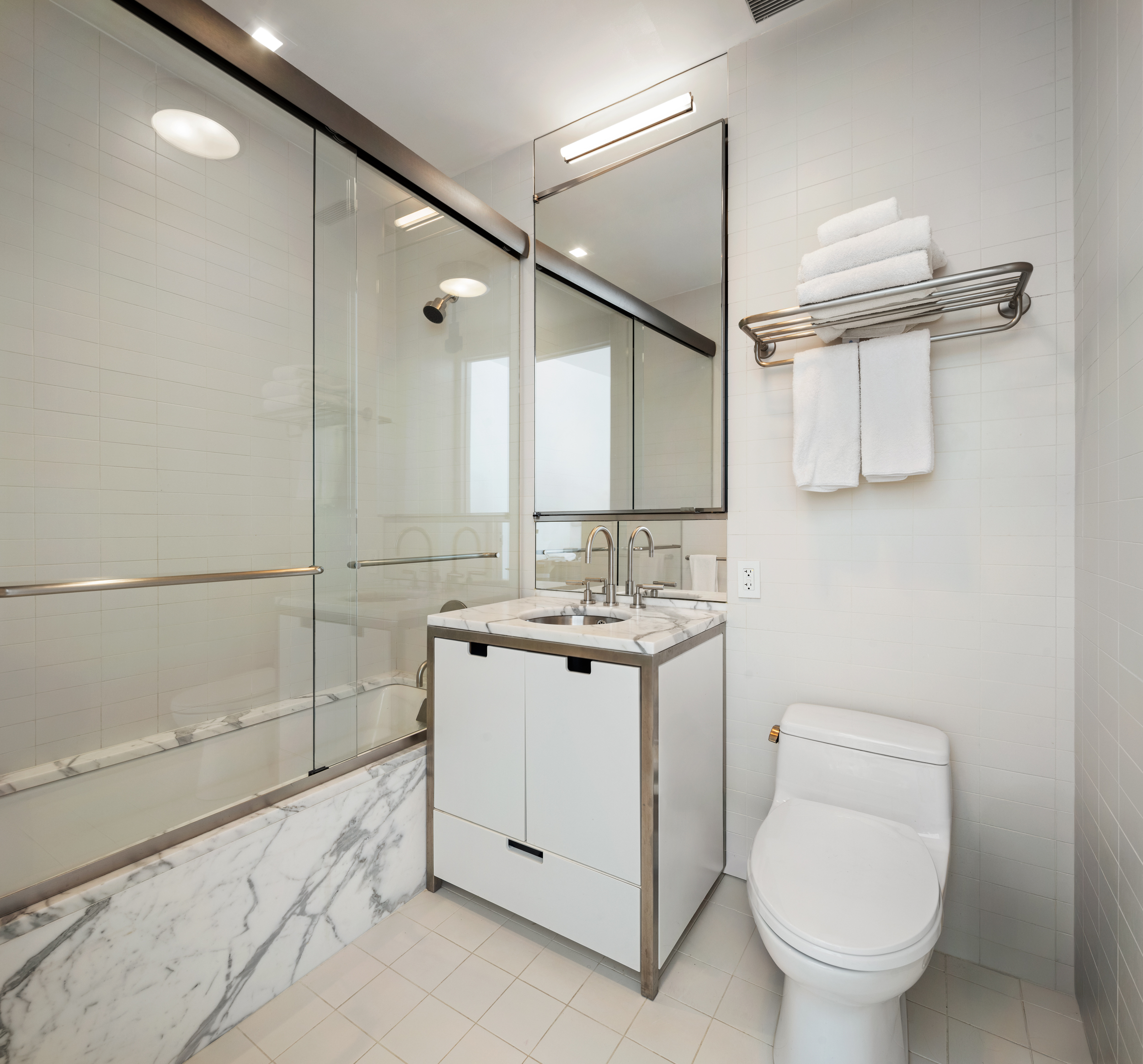 350 West Broadway, Unit 7FL Manhattan, NY 10013 - Photo 14 of 17 a bathroom with a sink toilet and shower