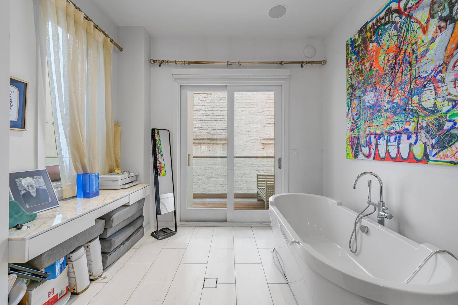 124 East 13th Street, Unit 3 Manhattan, NY 10003 - Photo 17 of 26 a spacious bathroom with a double vanity sink and a tub