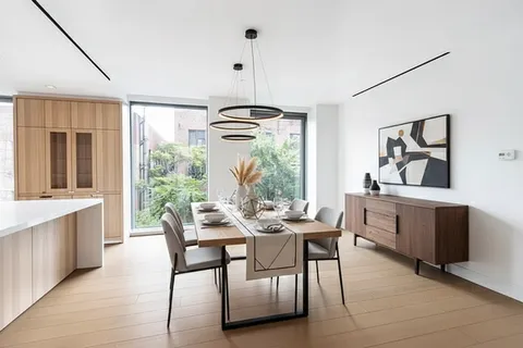 a dining room with furniture and window