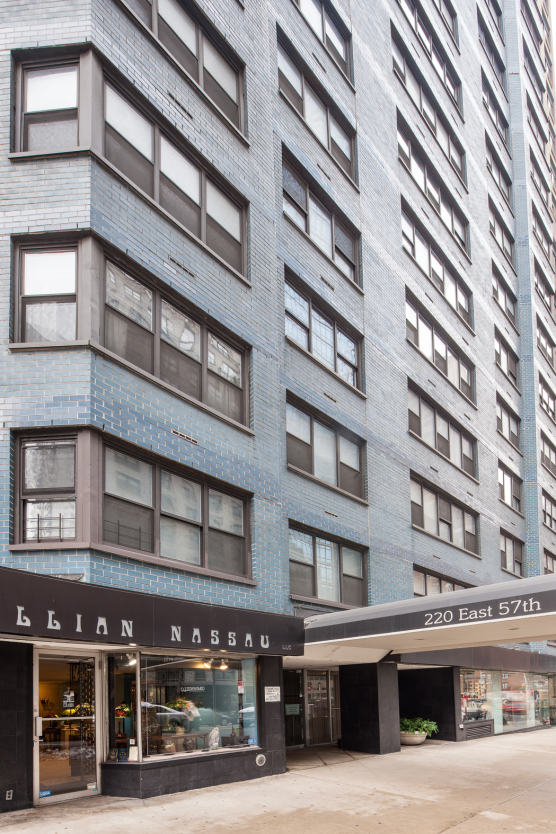 220 East 57th Street, Unit 12E Manhattan, NY 10022 - Photo 6 of 8 a tall building sitting on the side of a street