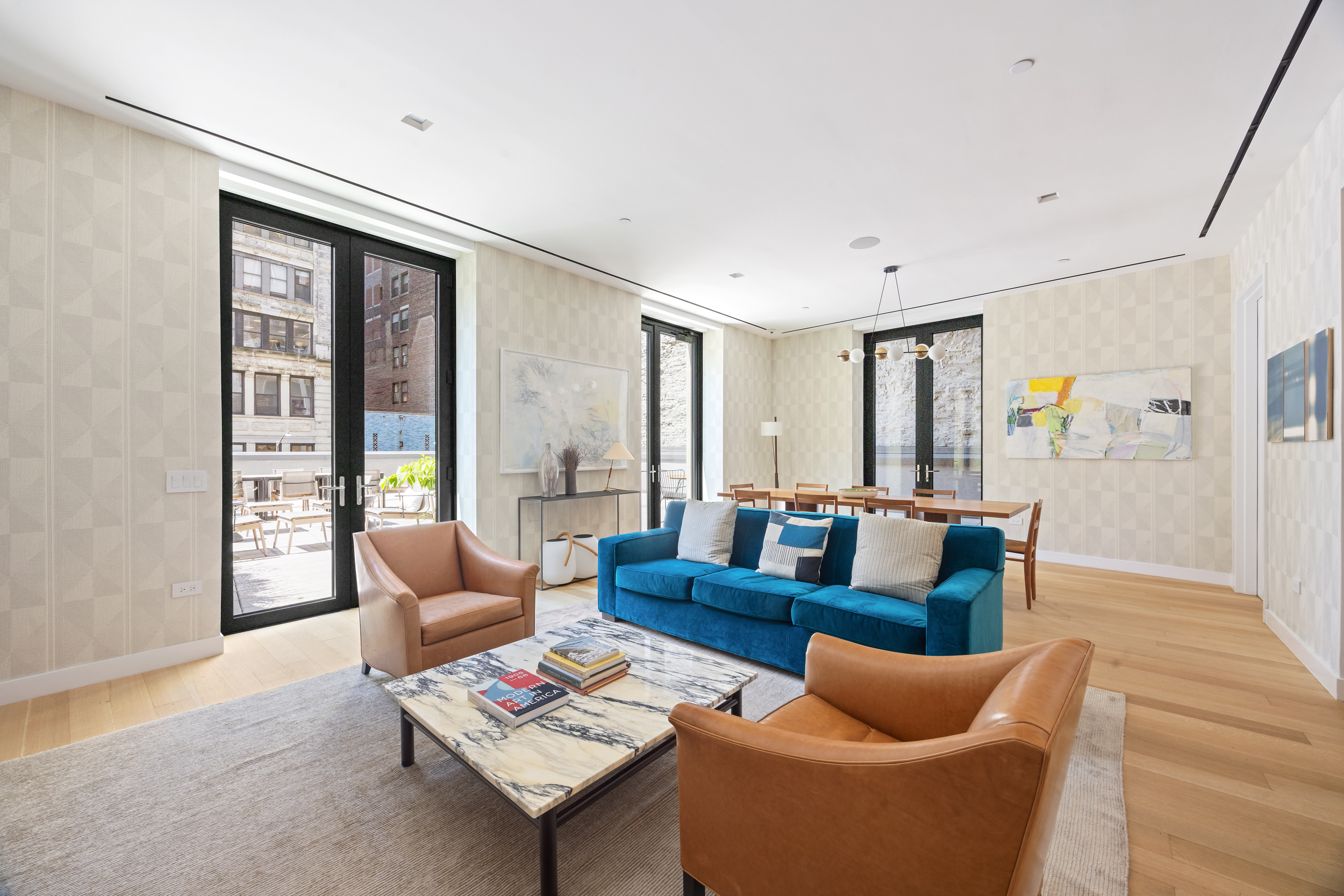21 East 12th Street, Unit 8A Manhattan, NY 10003 - Photo 15 of 20 a living room with furniture and a large window