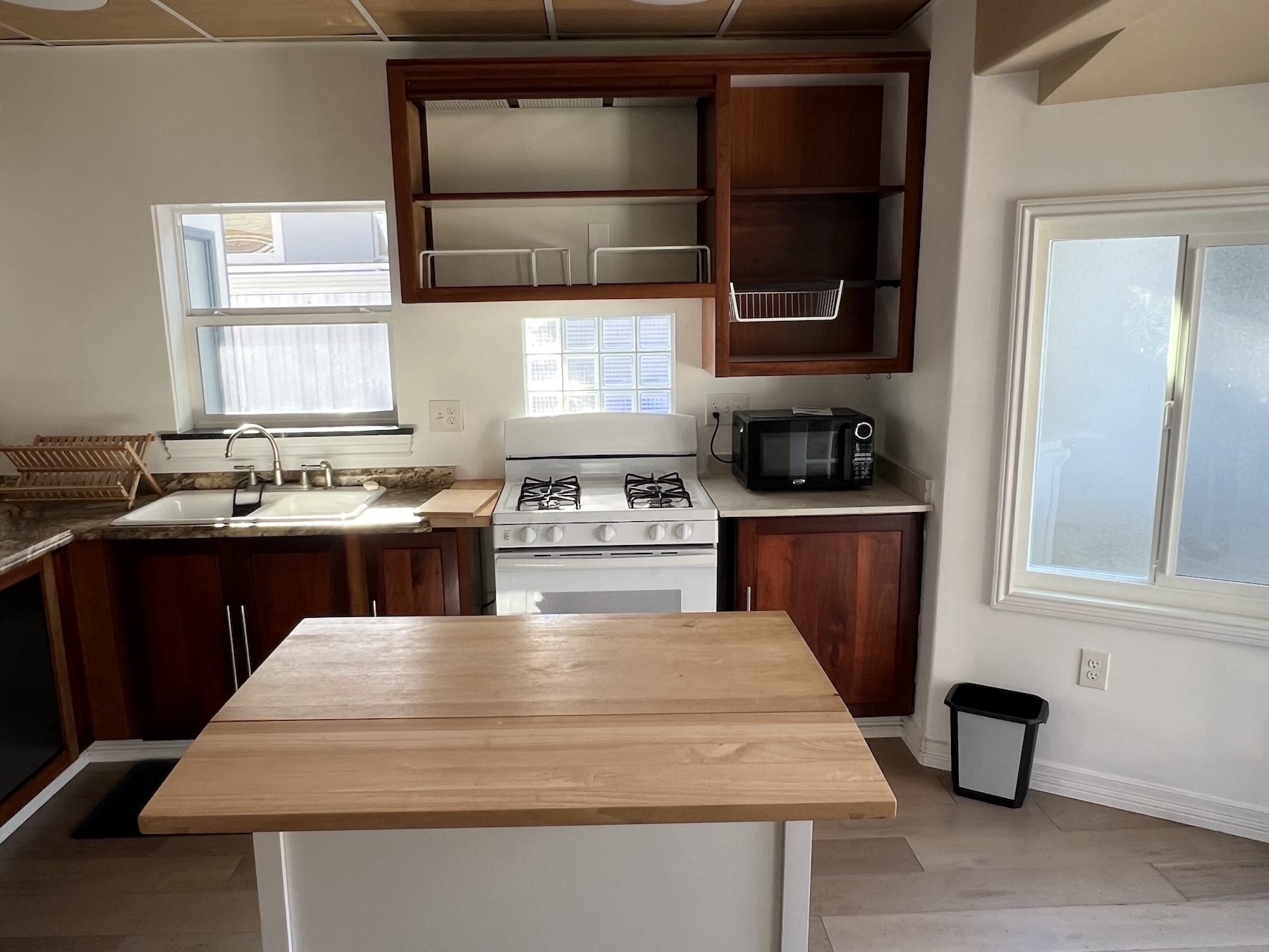 534 Hoover Street Oceanside, CA 92054 - Photo 25 of 31 a kitchen that has a sink and a stove