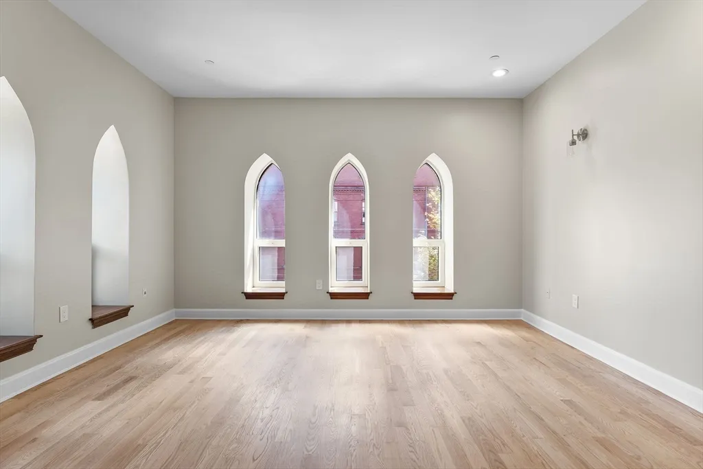 wooden floor in an empty room with window