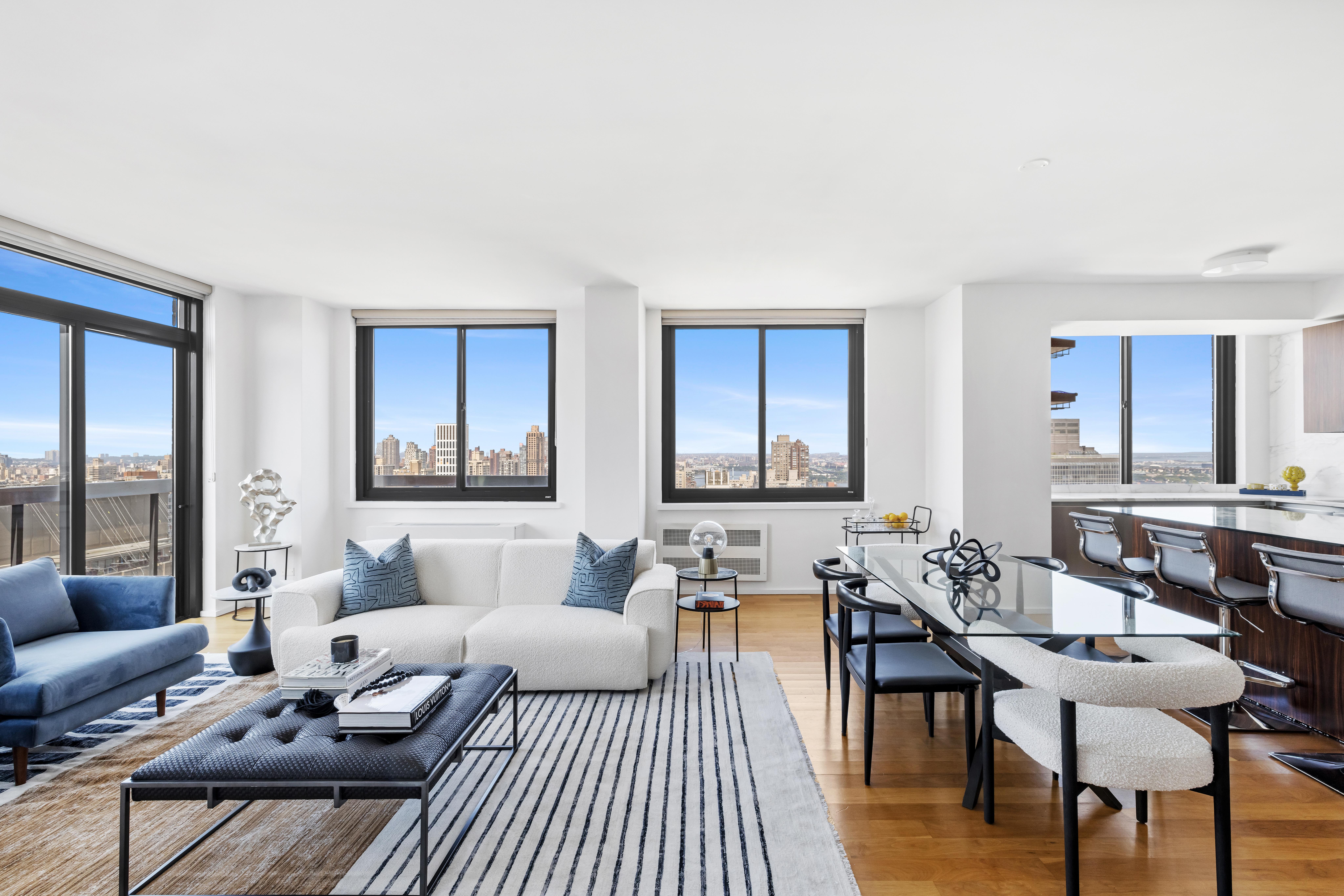 515 East 72nd Street, Unit 40E Manhattan, NY 10021 - Photo 3 of 34 a living room with furniture and a table