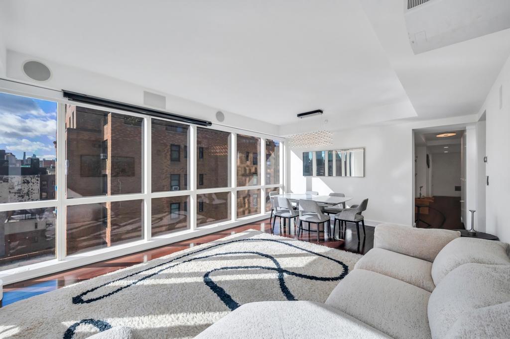 2628 Broadway, Unit 15B Manhattan, NY 10025 - Photo 2 of 22 a living room with furniture and a large window