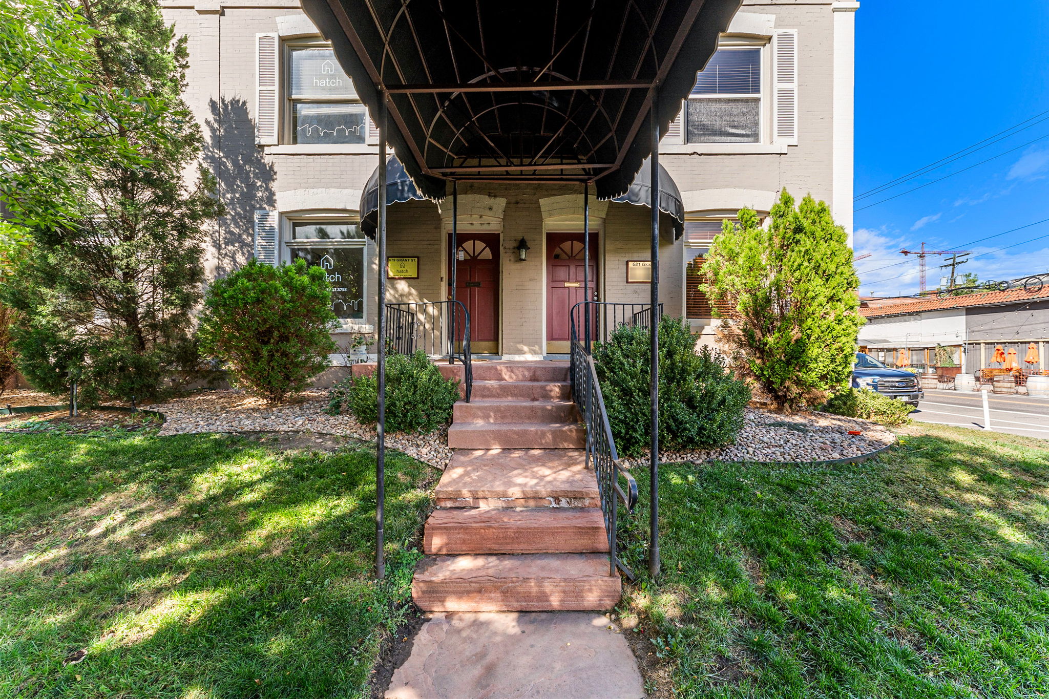 681 Grant Street Denver, CO 80203 - Photo 3 of 15 a front view of a house with a yard