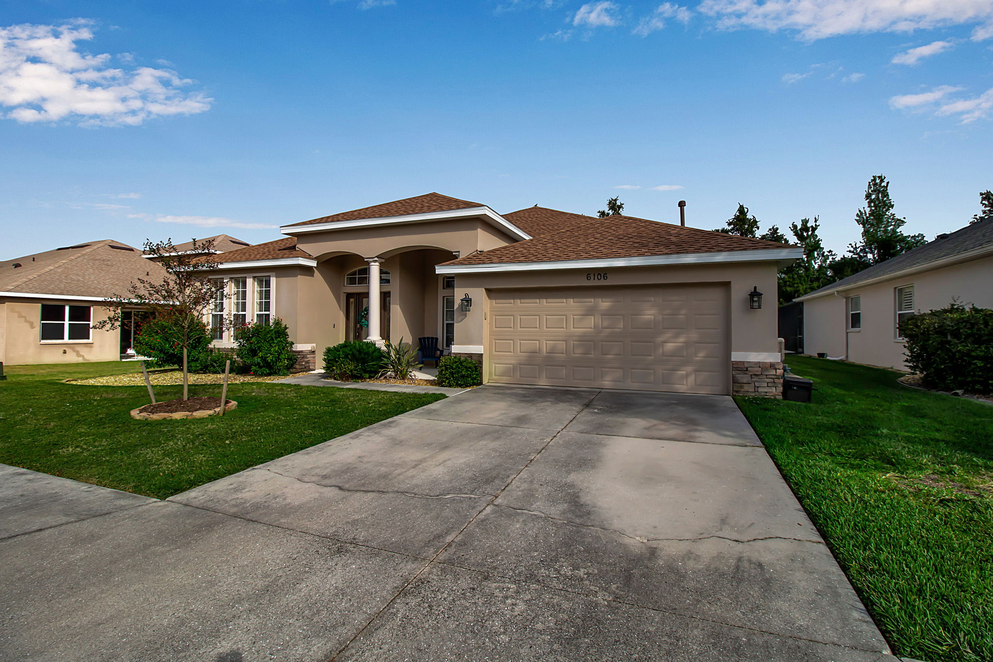 6106 34th Court East Bradenton, FL 34203 - Photo 8 of 69 a front view of a house with a yard