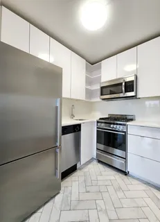 a kitchen with a stove and a microwave