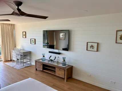 a large white bed in a white room
