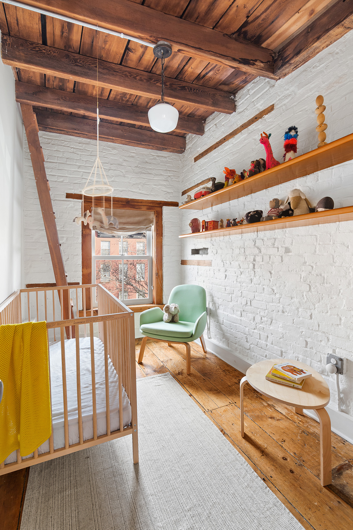 246 Bergen Street Brooklyn, NY 11217 - Photo 17 of 20 a living room with furniture and a wooden floor