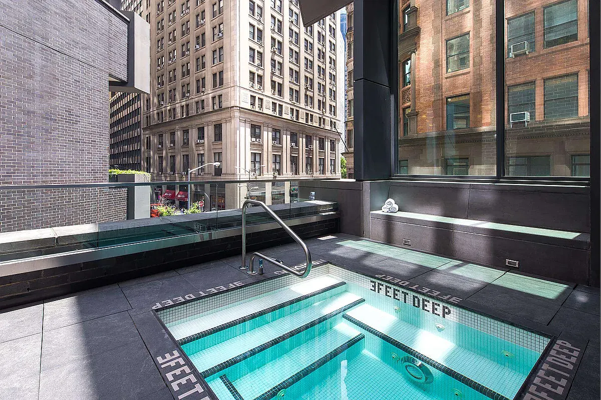 15 William Street, Unit 21A Manhattan, NY 10005 - Photo 15 of 19 a view of a building from a balcony